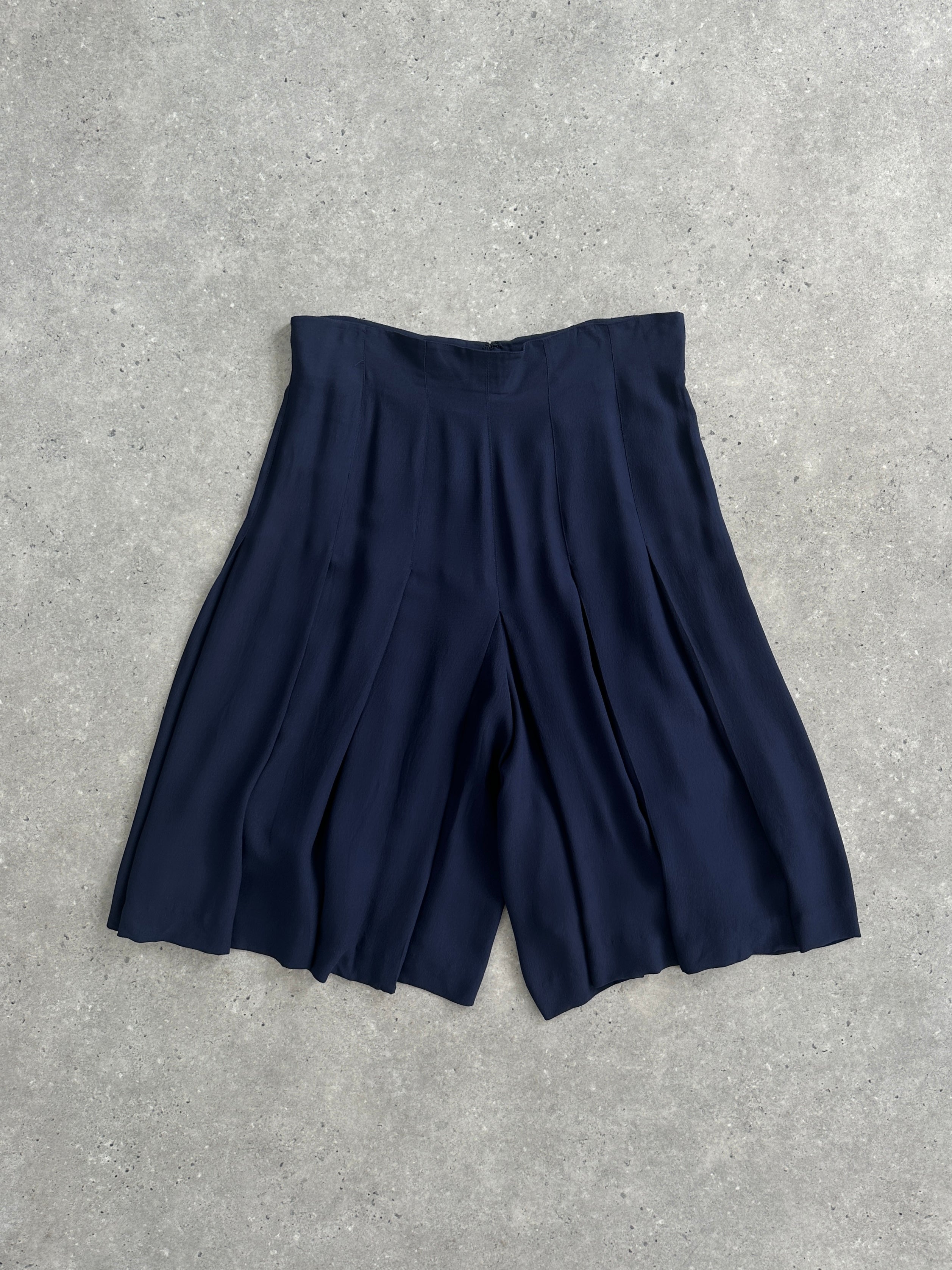 Valentino Boutique high-waisted pleated culottes, 80s-90s style, W32, with wide-leg shorts and classic pleats, displayed on a hanger.