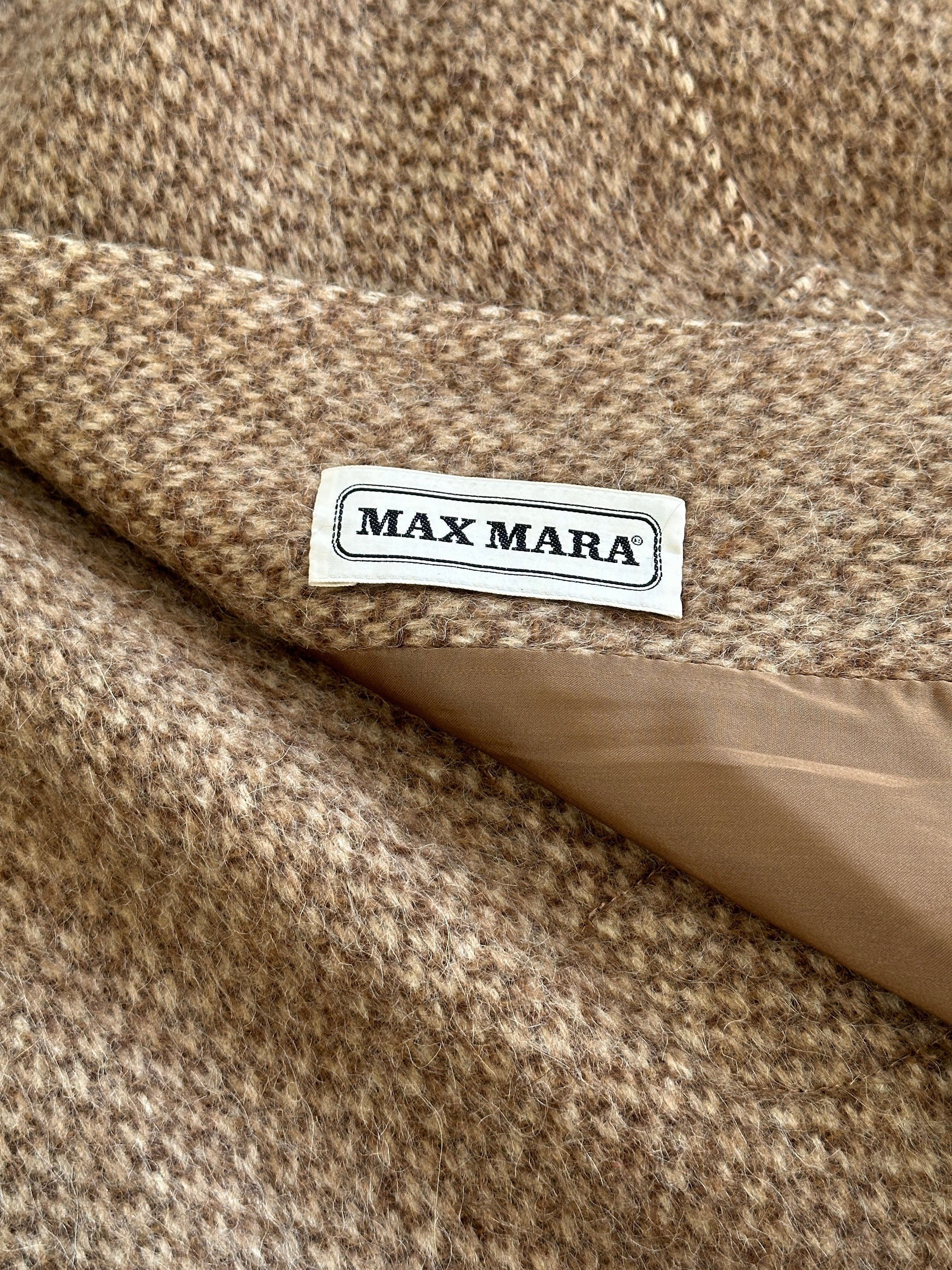 Max Mara pure wool fuzzy coat with concealed placket, in size L, showcasing the cozy, textured fabric and classic design.