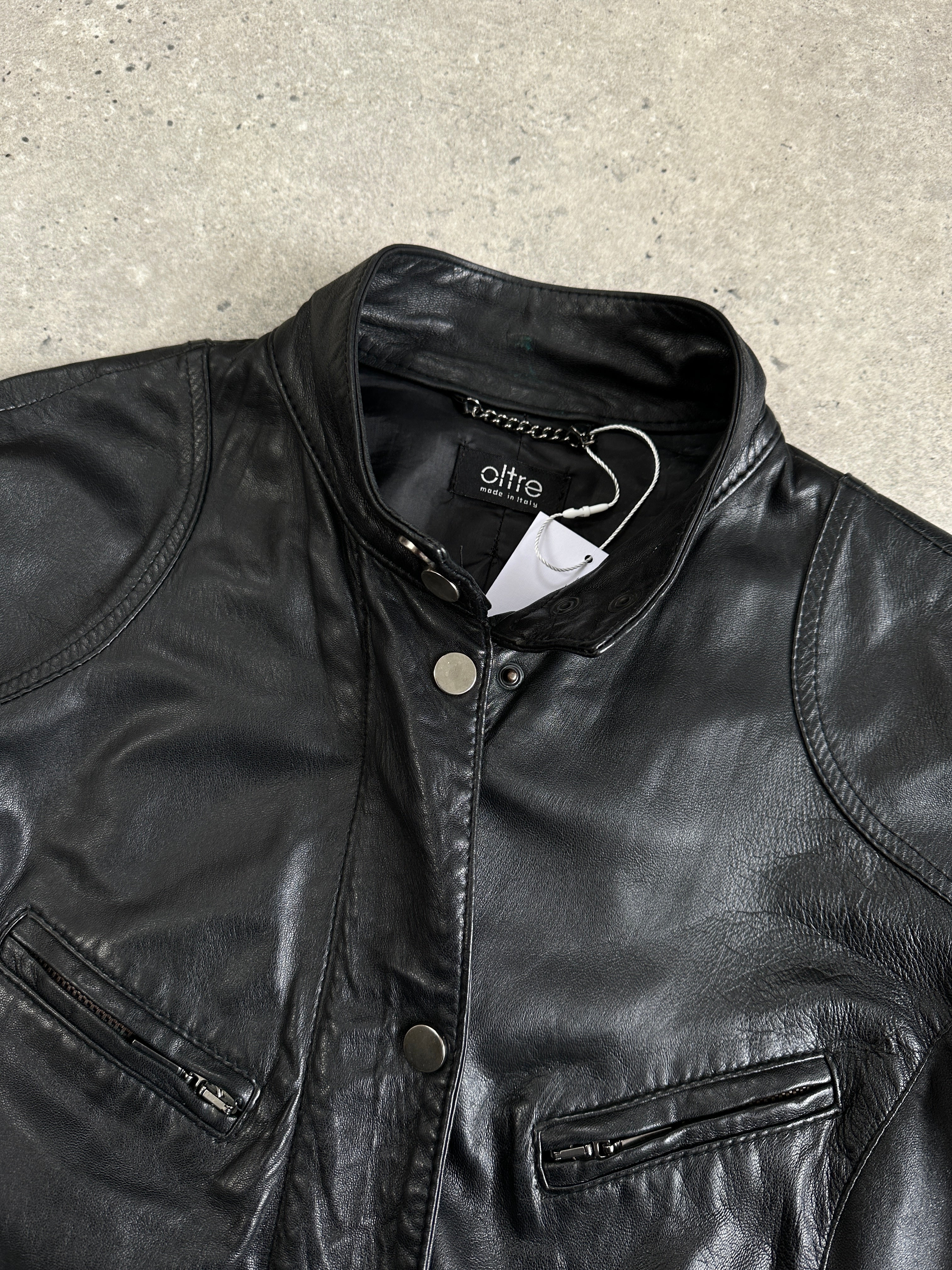 Vintage Italian double zip fitted biker leather jacket in black, featuring classic design and structured fit, size S/M.