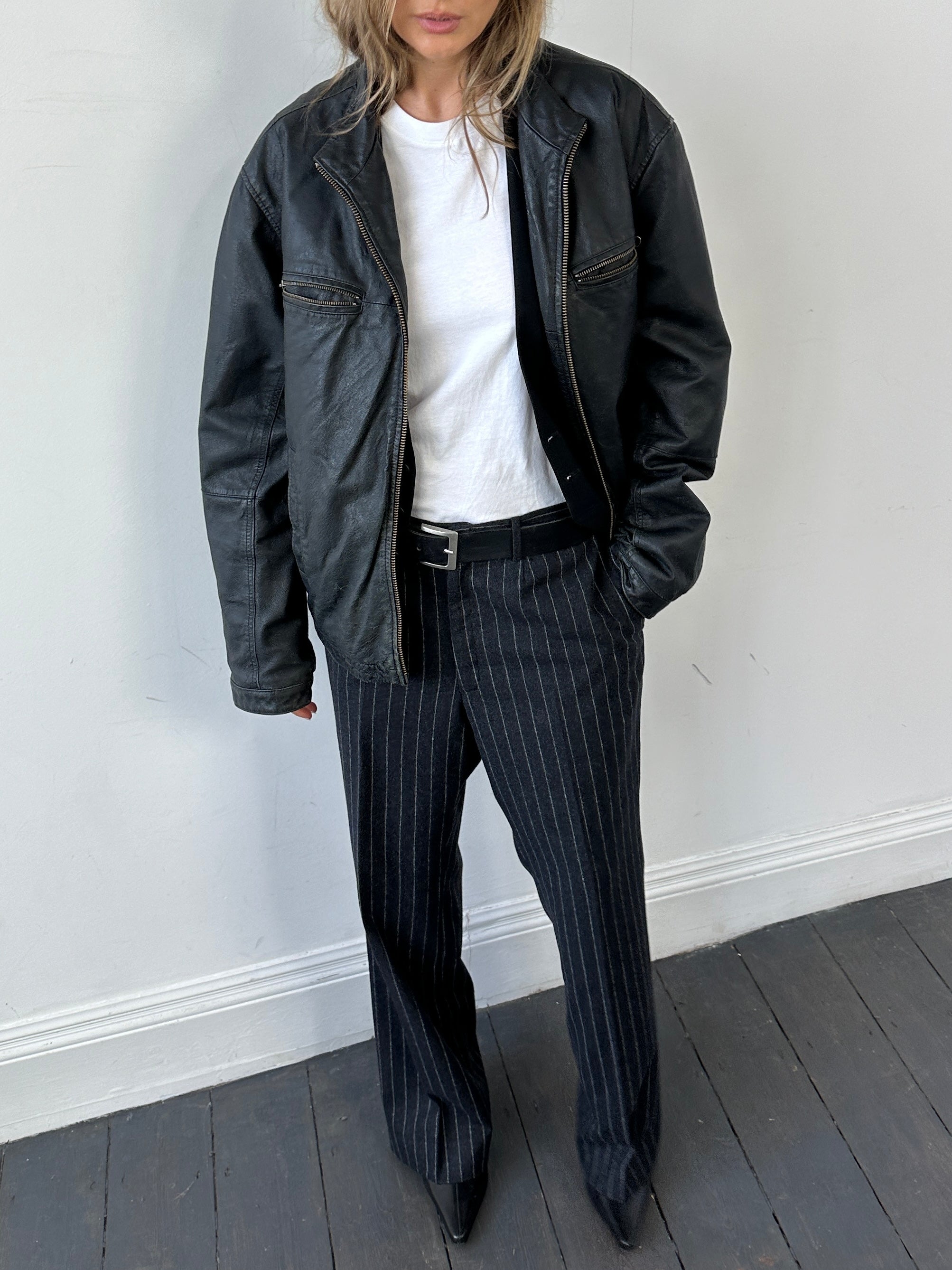 Vintage leather zip-up jacket for men, size large, featuring classic design and durable leather material.