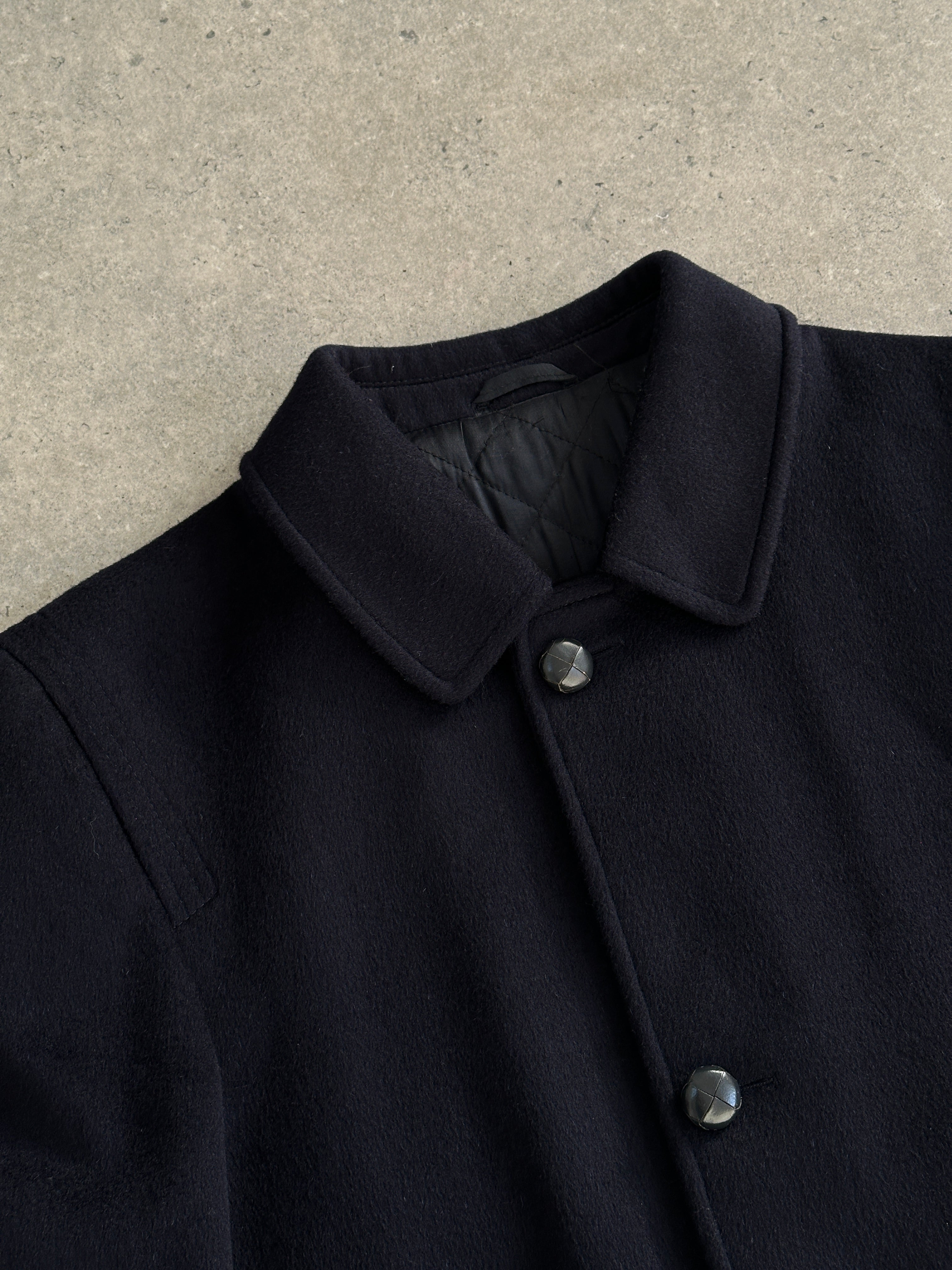 Vintage wool alpaca single-breasted coat in size L, featuring classic tailored design and warm fabric, displayed on a hanger.