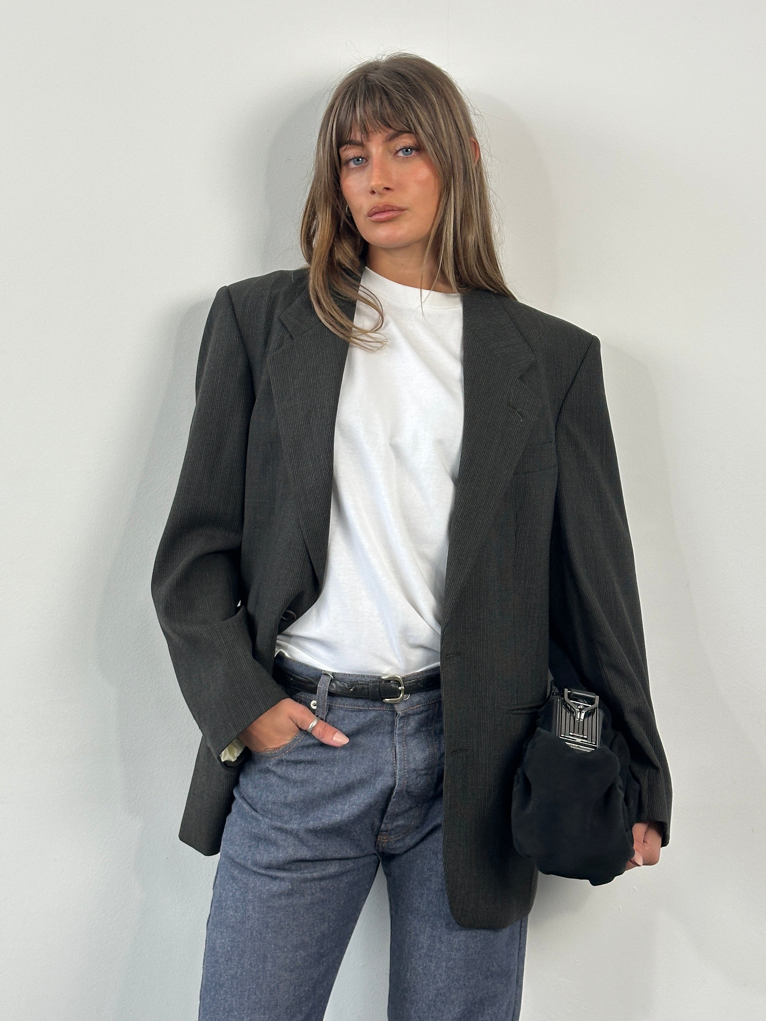 Yves Saint Laurent 1990s pure wool single-breasted blazer in size 40R/M, shown in a classic tailored fit with lapel collar.