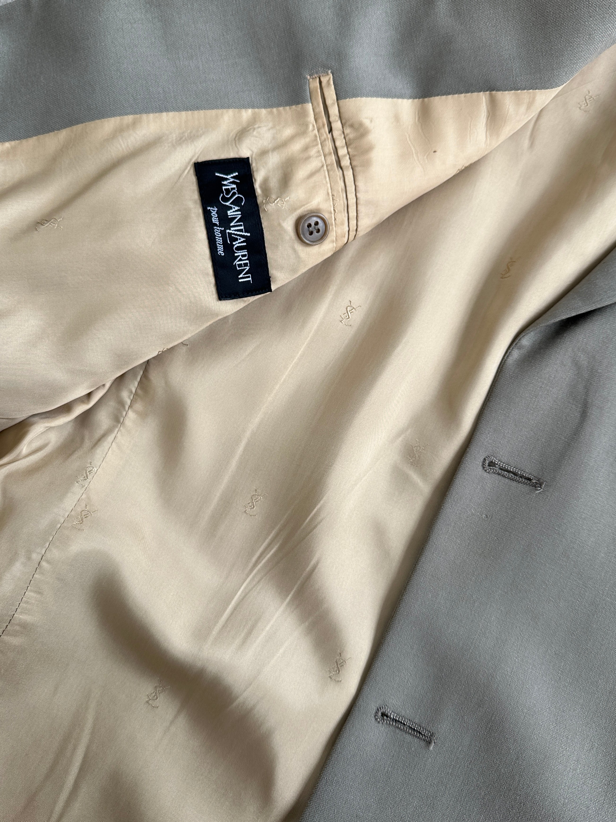 Yves Saint Laurent Pour Homme XL wool single-breasted blazer in classic design, shown on a hanger.