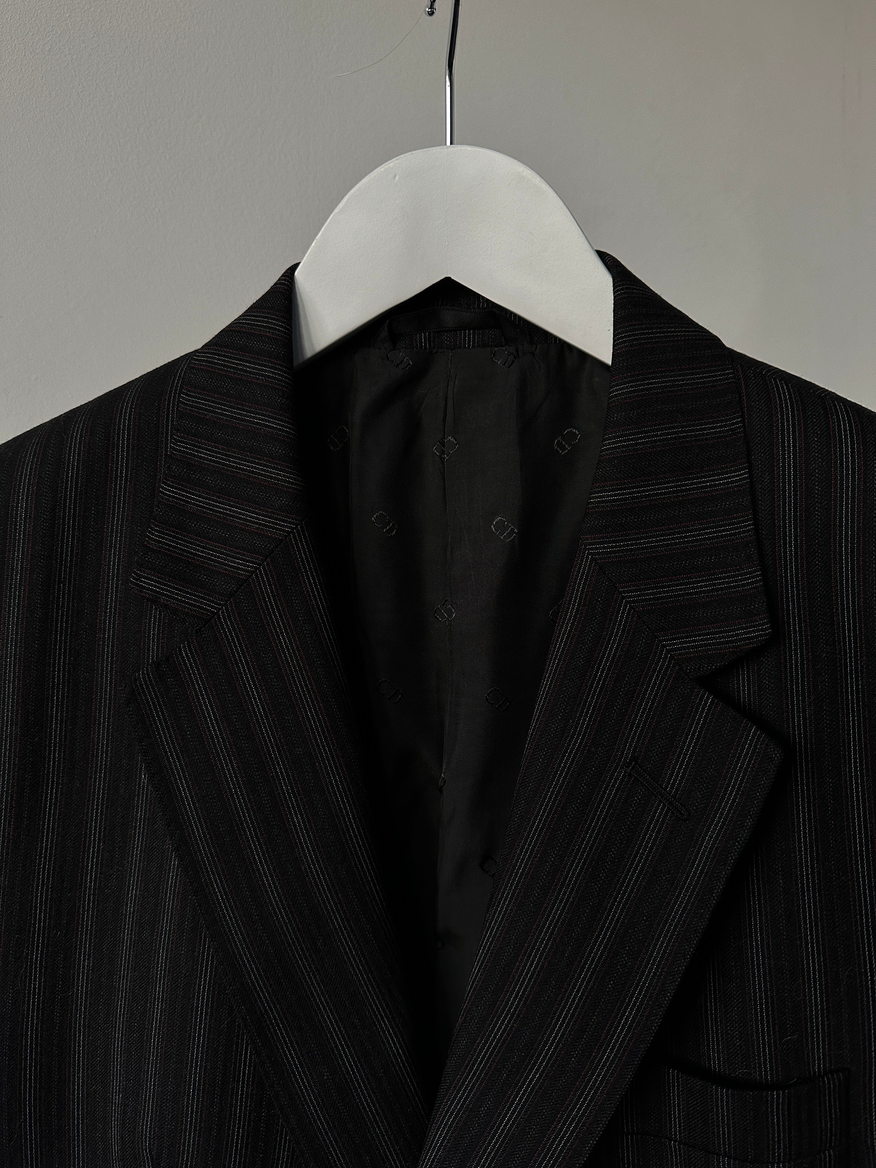 Christian Dior pure wool pinstripe jumpsuit in size 42L/W34, tailored fit with classic pinstripe pattern and structured collar.