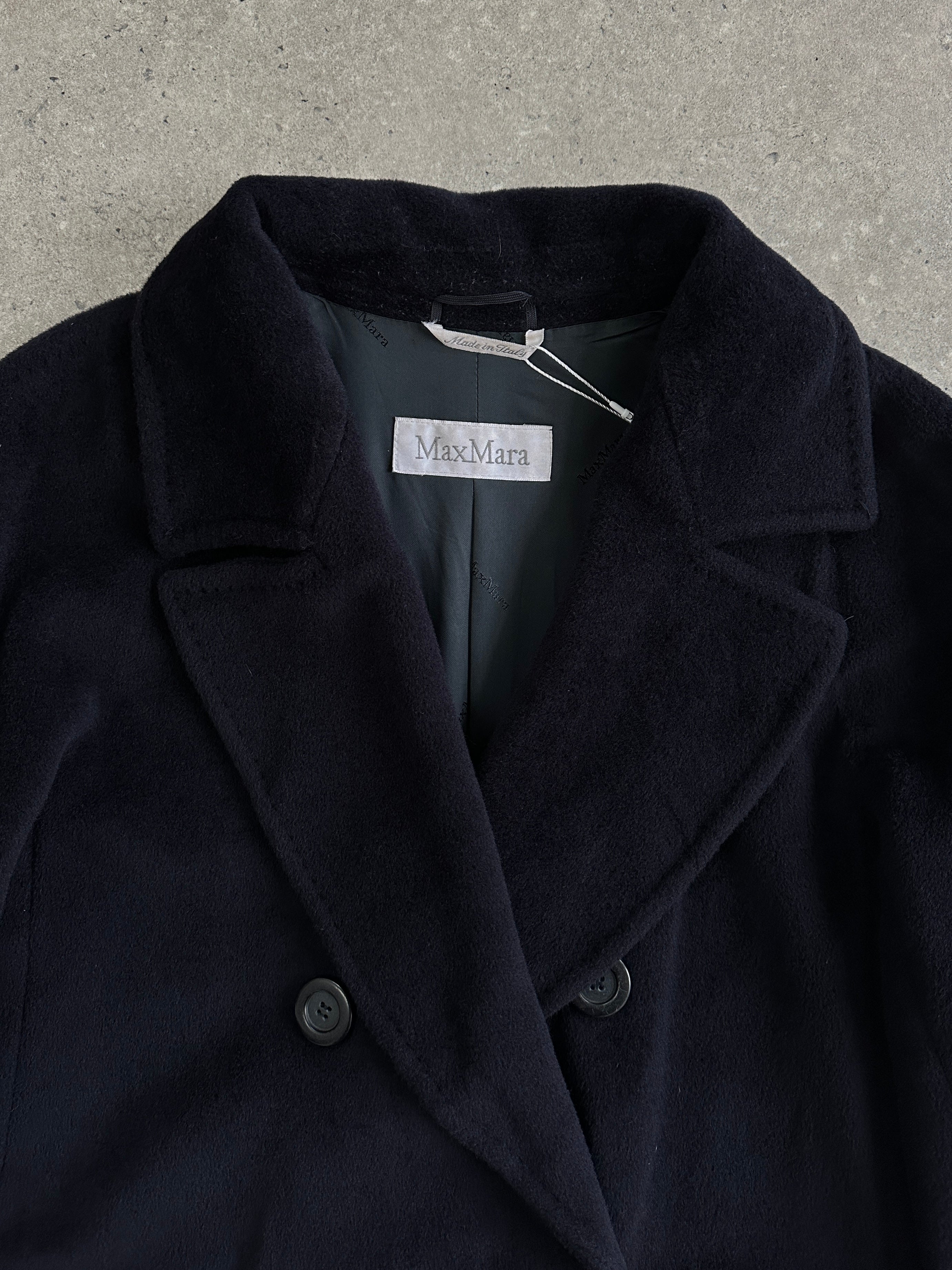 Max Mara wool cashmere double-breasted A-line coat in size large, featuring a classic tailored design and elegant lapel collar.