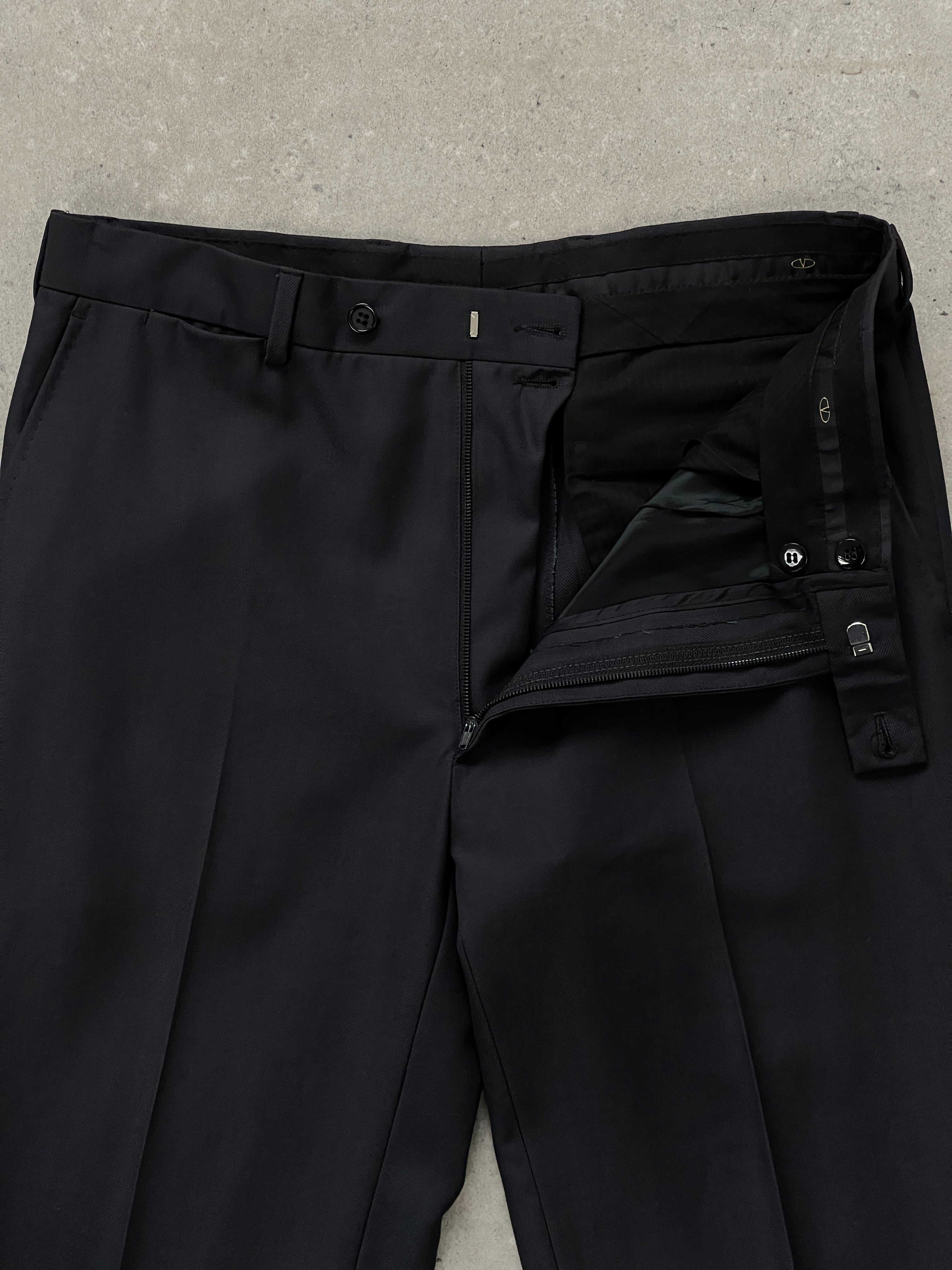 Valentino 1990s wool tailored trousers in size W32, featuring a classic fit with a high waist and tailored leg design.