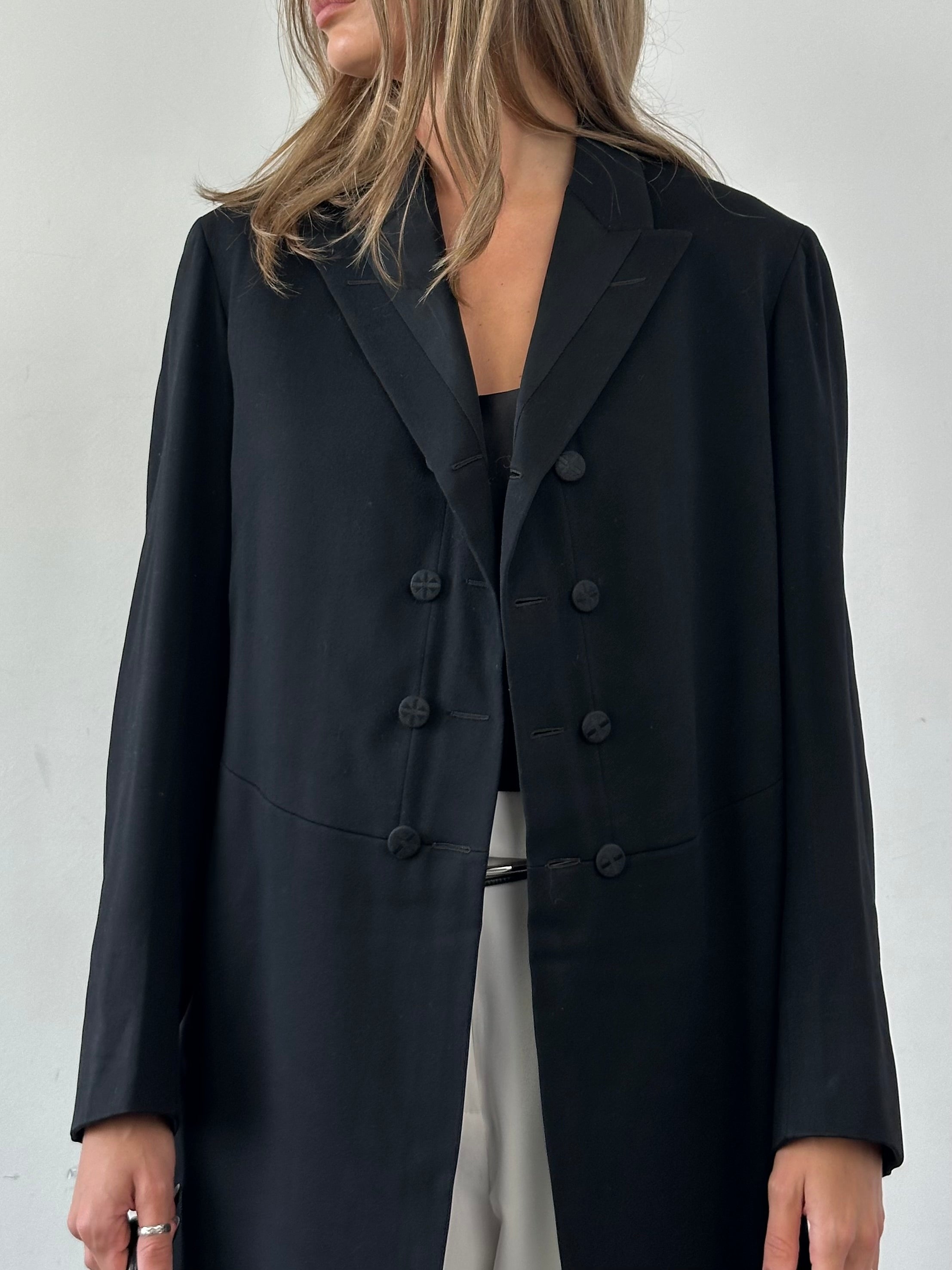 Vintage tuxedo coat in size M/L, classic black formal coat with satin lapels, tailored for elegant evening wear.