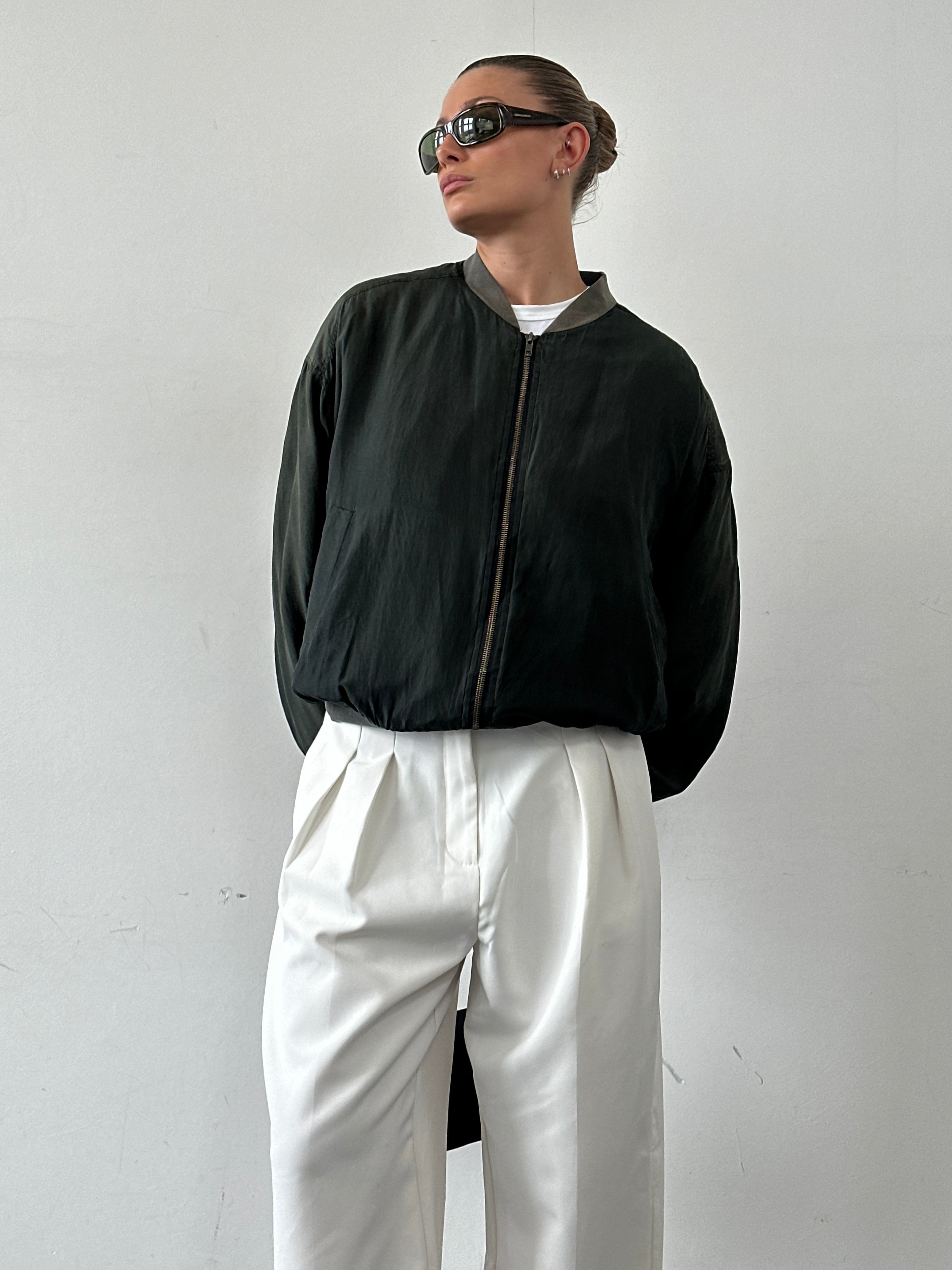Vintage pure silk bomber jacket in size large, soft fabric with a classic style and ribbed cuffs and collar.