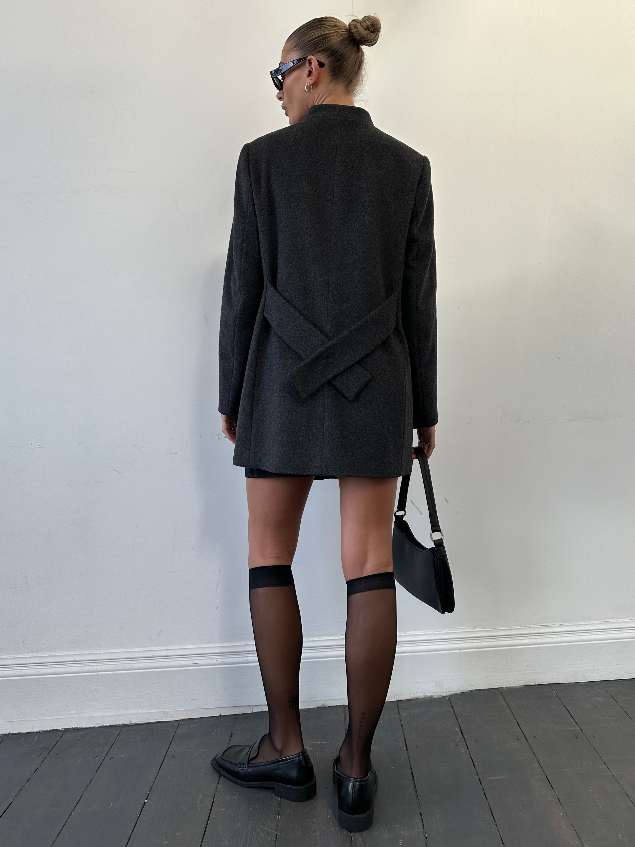 Jaeger minimal wool cashmere coat in size M, tailored fit with a sleek design, shown on a hanger.