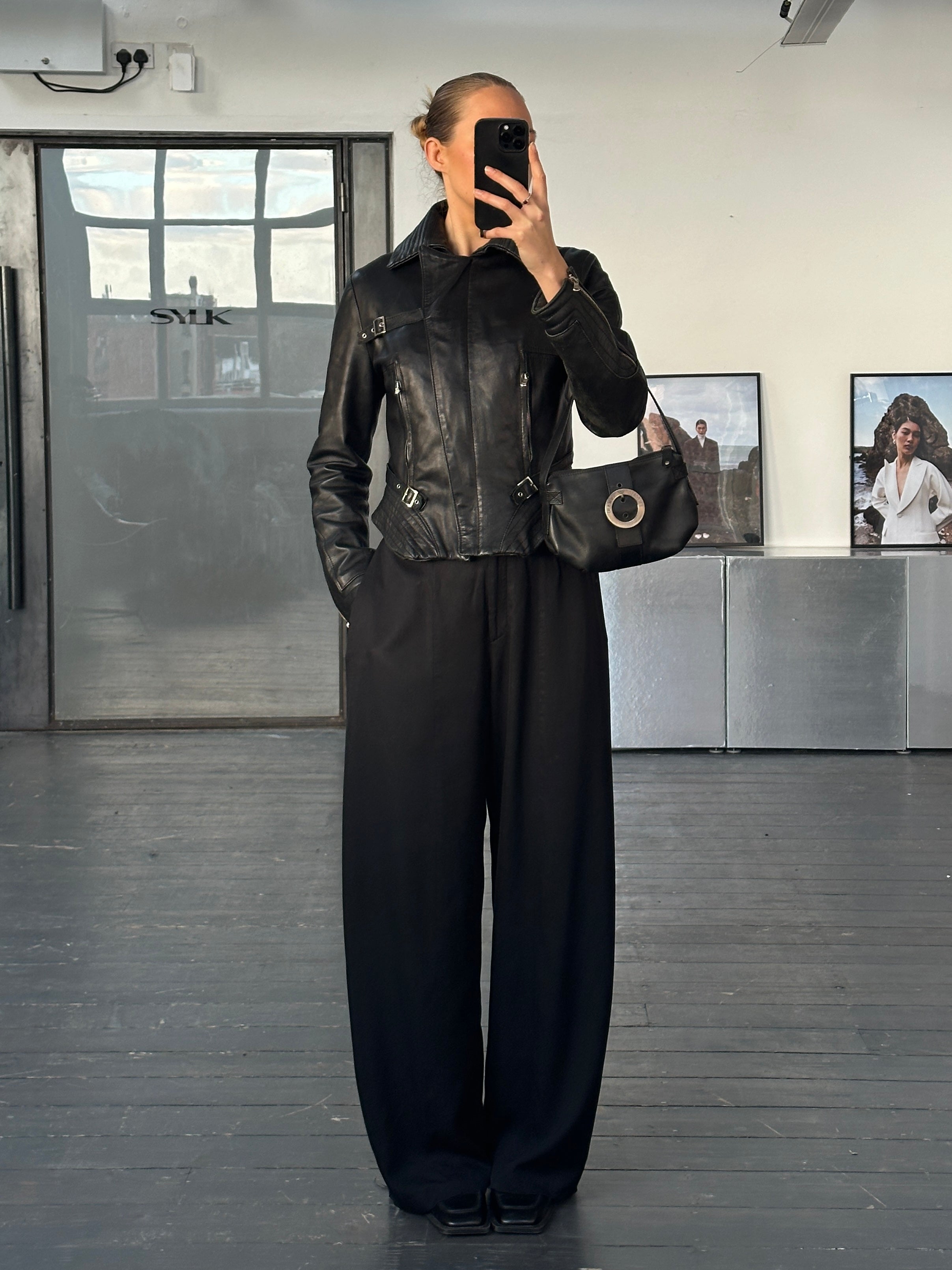 Vintage Italian 1990s fitted leather jacket with buckled details, stylish and authentic leather jacket in size small.