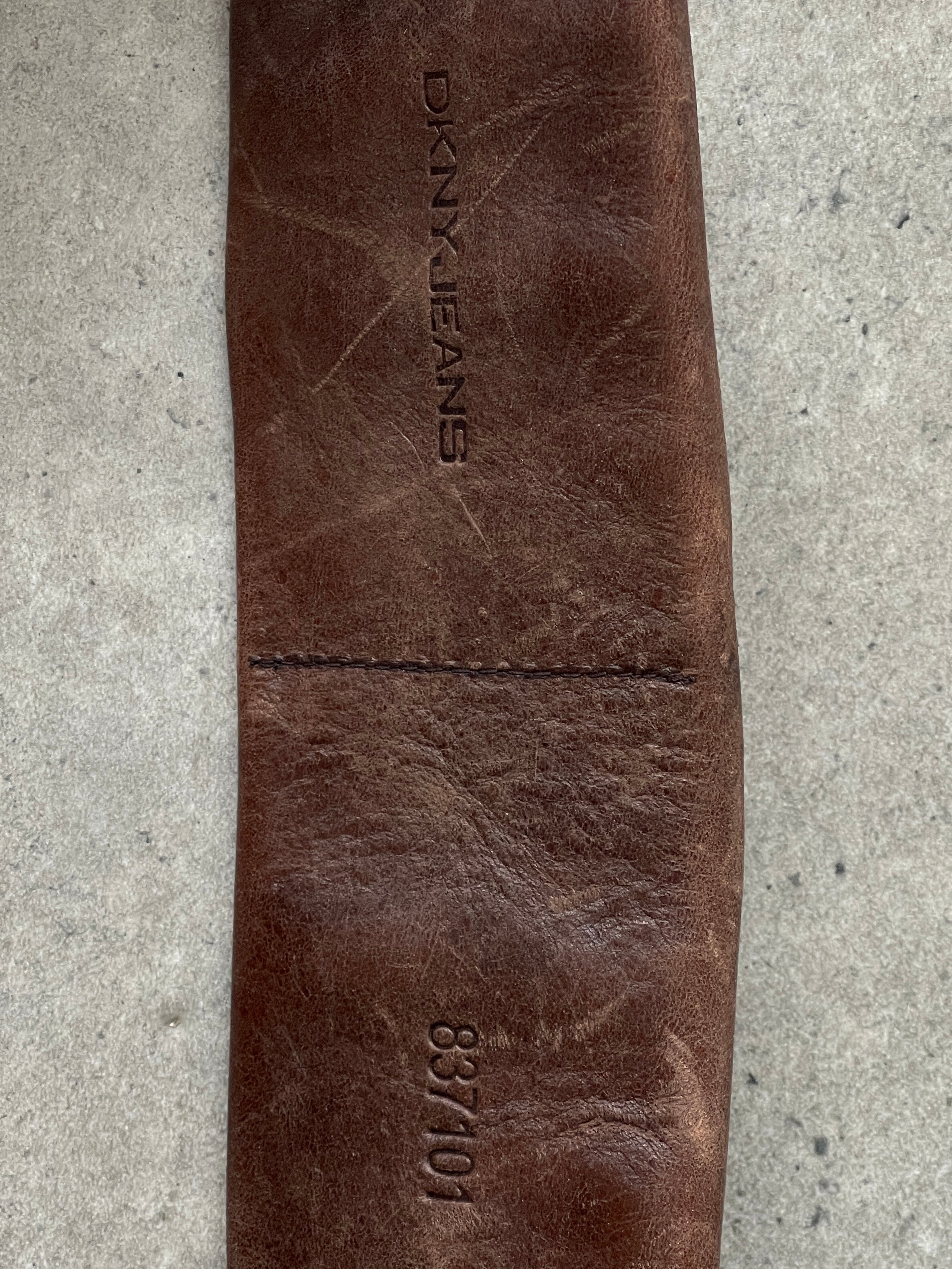 DKNY leather chunky utility belt bag with adjustable W31-33 waist, featuring a rugged design and multiple compartments.