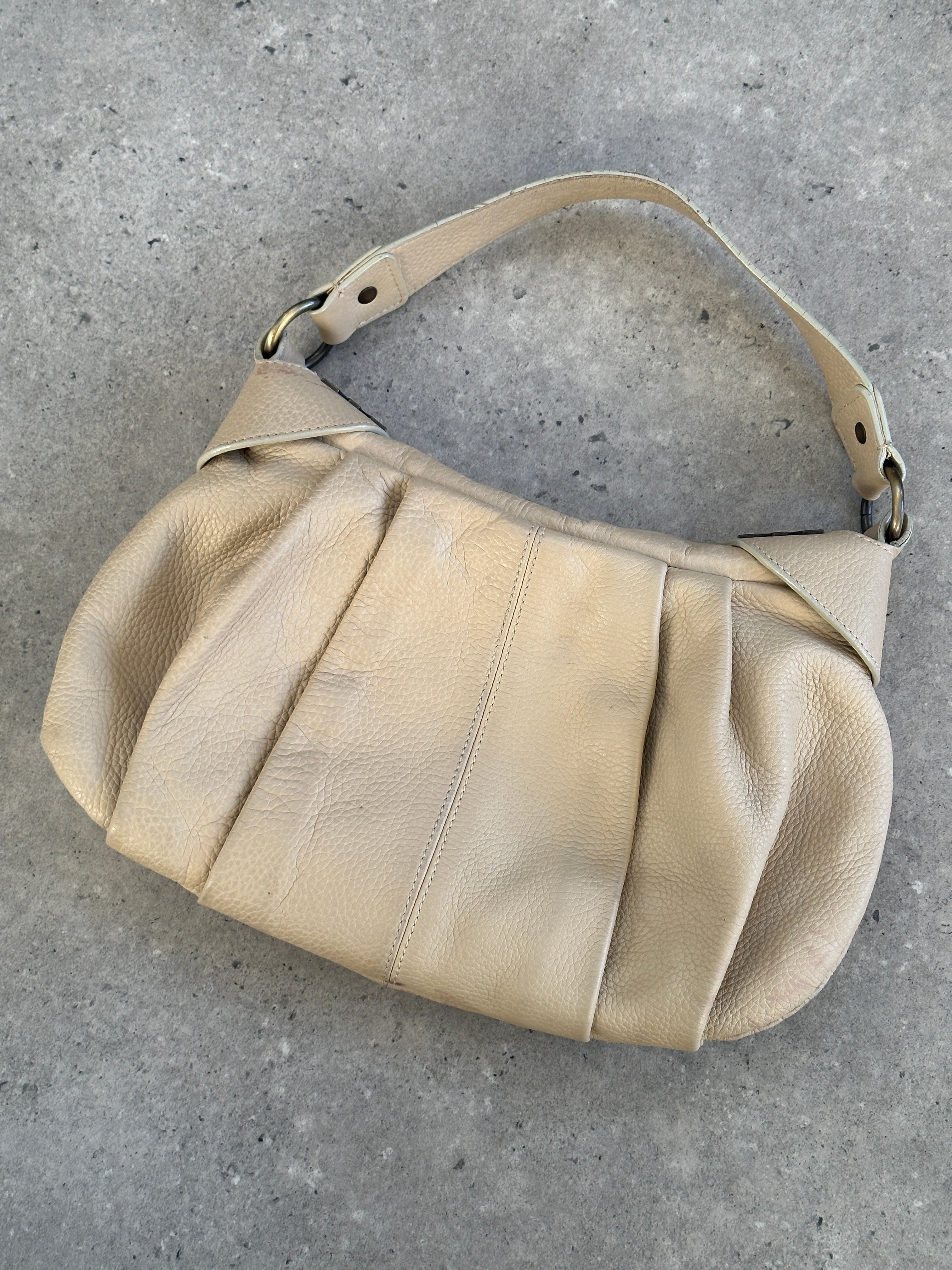 Emporio Armani 2000s leather pleated shoulder bag with sleek design and structured shape, featuring a classic fashion accessory.