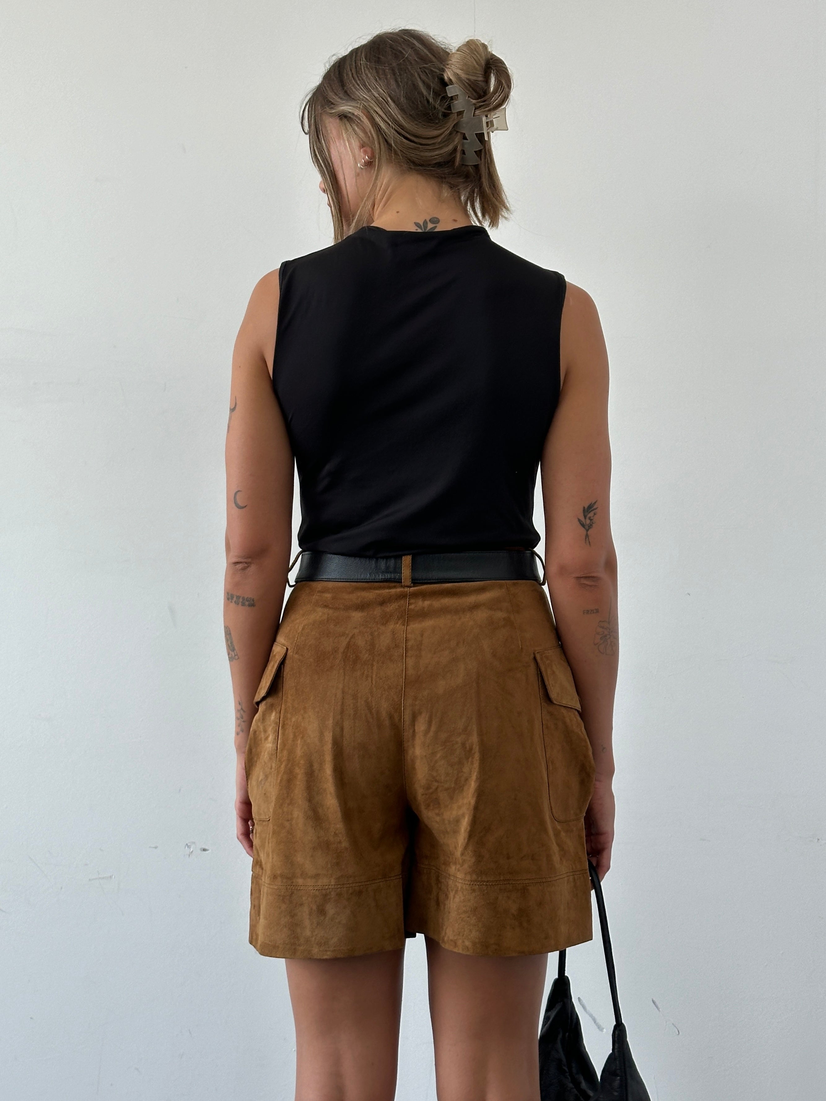 Italian Vintage high-waisted suede leather shorts in W27 size, featuring a classic vintage design and soft, textured suede material.