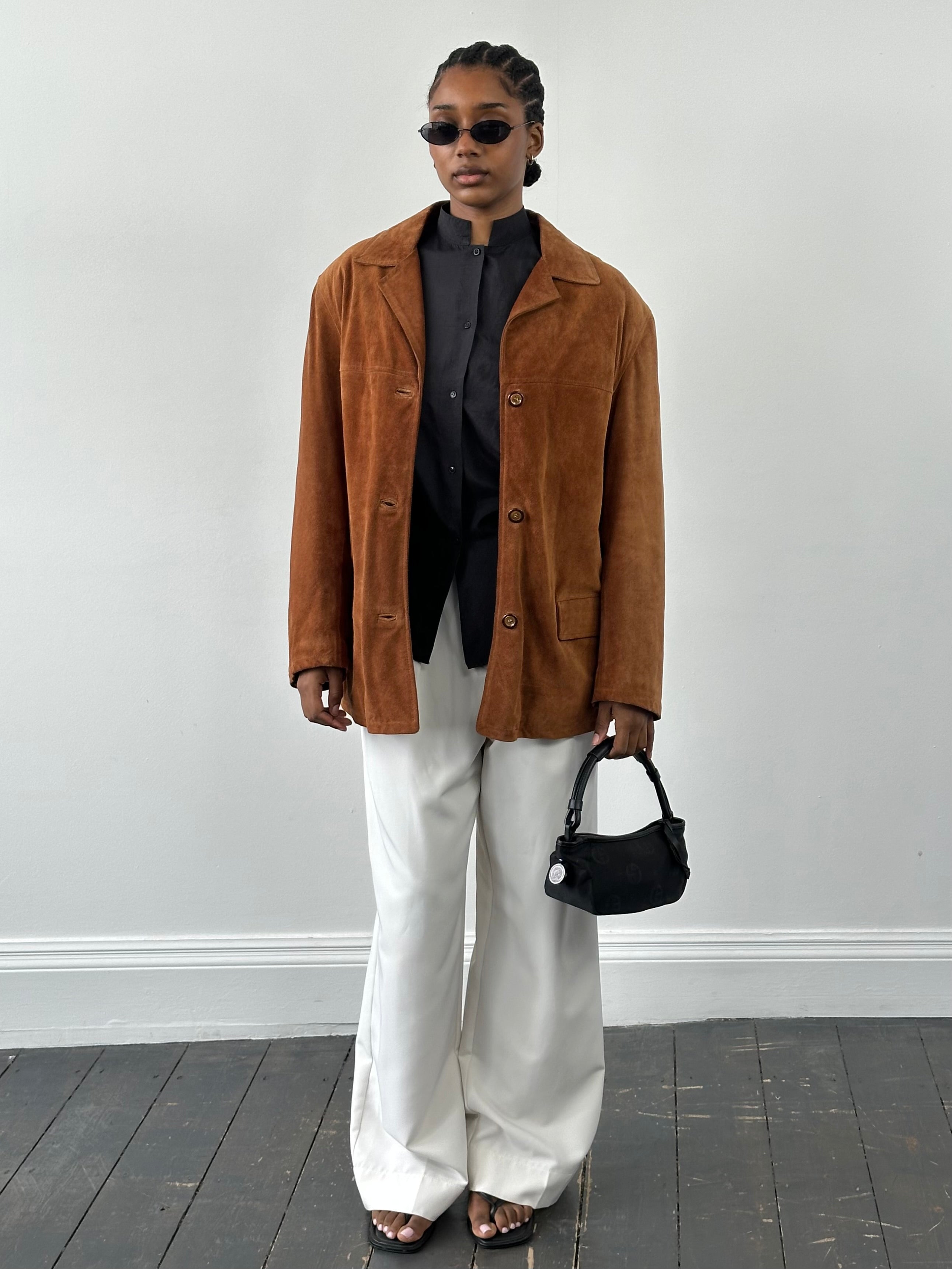 Vintage Italian 1990s suede leather jacket in size L, showcasing classic style and rich texture.