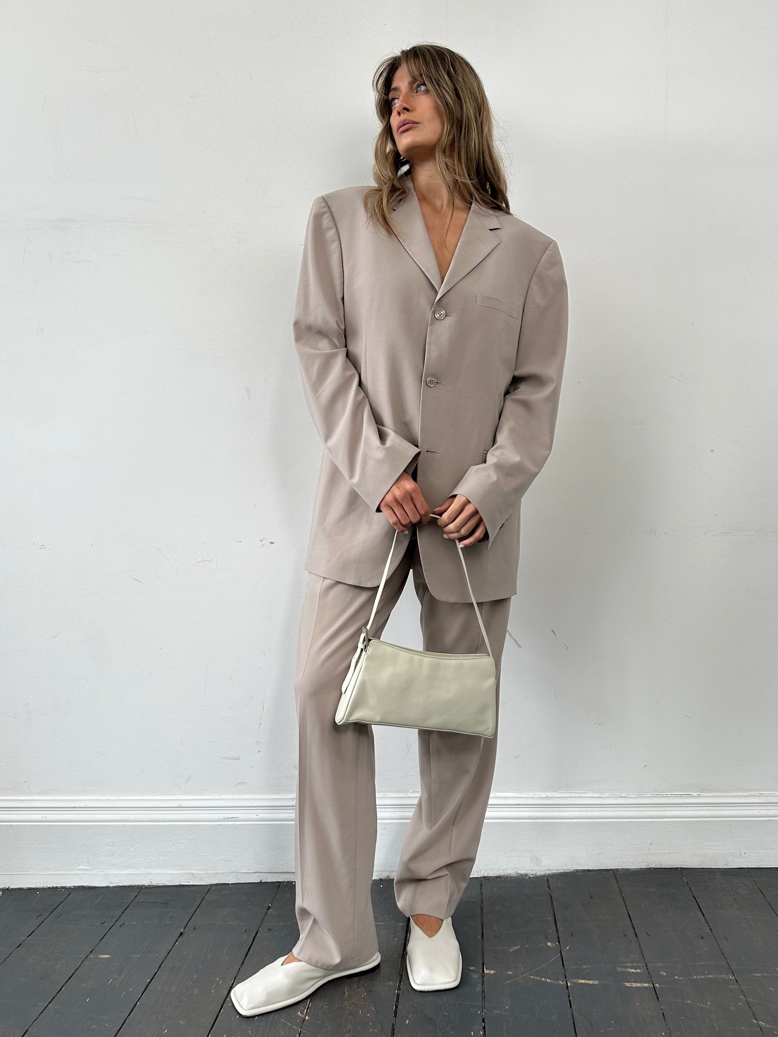 Versace single-breasted wool jumpsuit in size 42R/W30, tailored fit with sleek lapels and tailored silhouette.
