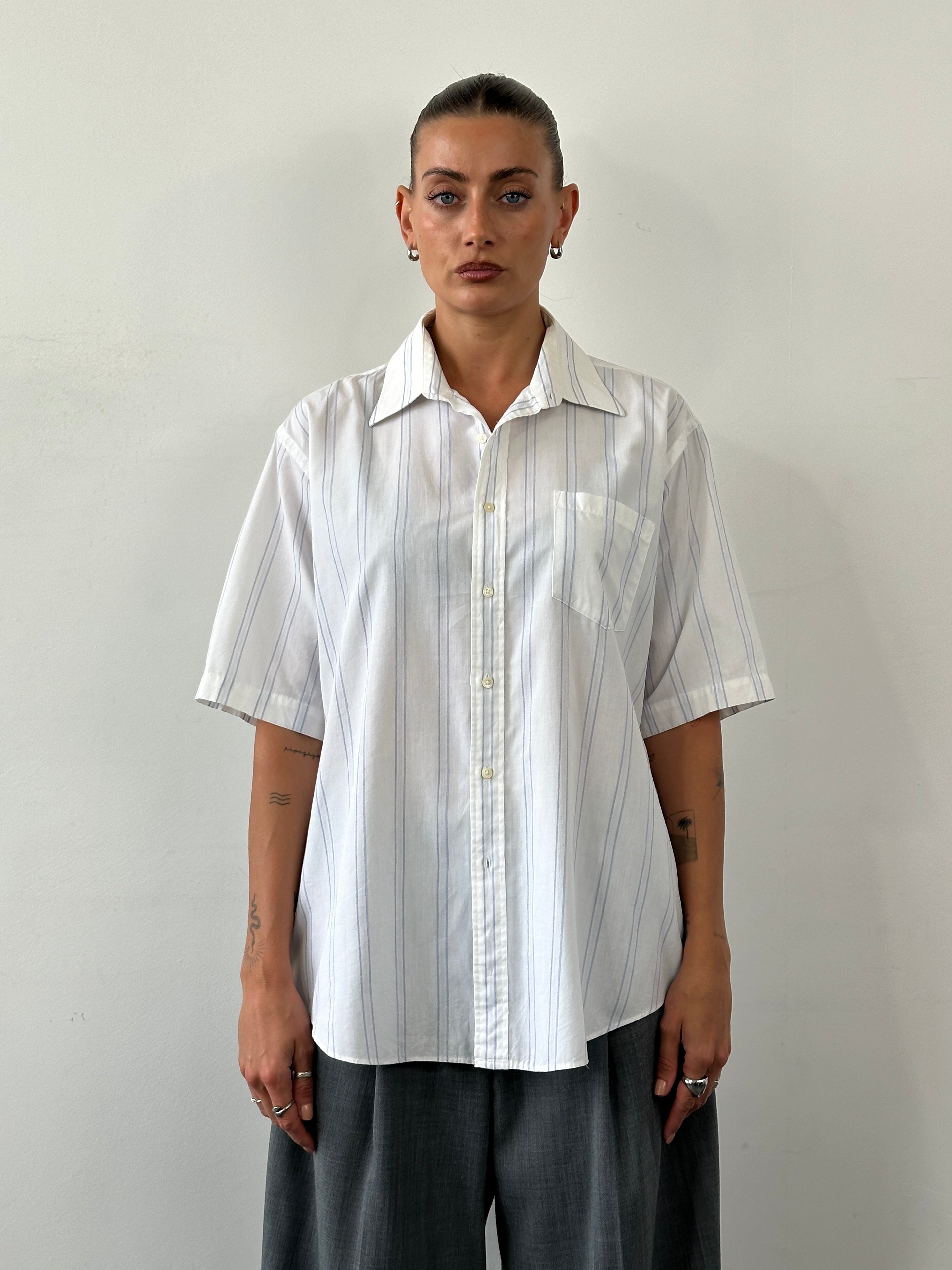 Yves Saint Laurent 80s striped cotton shirt in size L, featuring bold colorful horizontal stripes and classic button-up design.