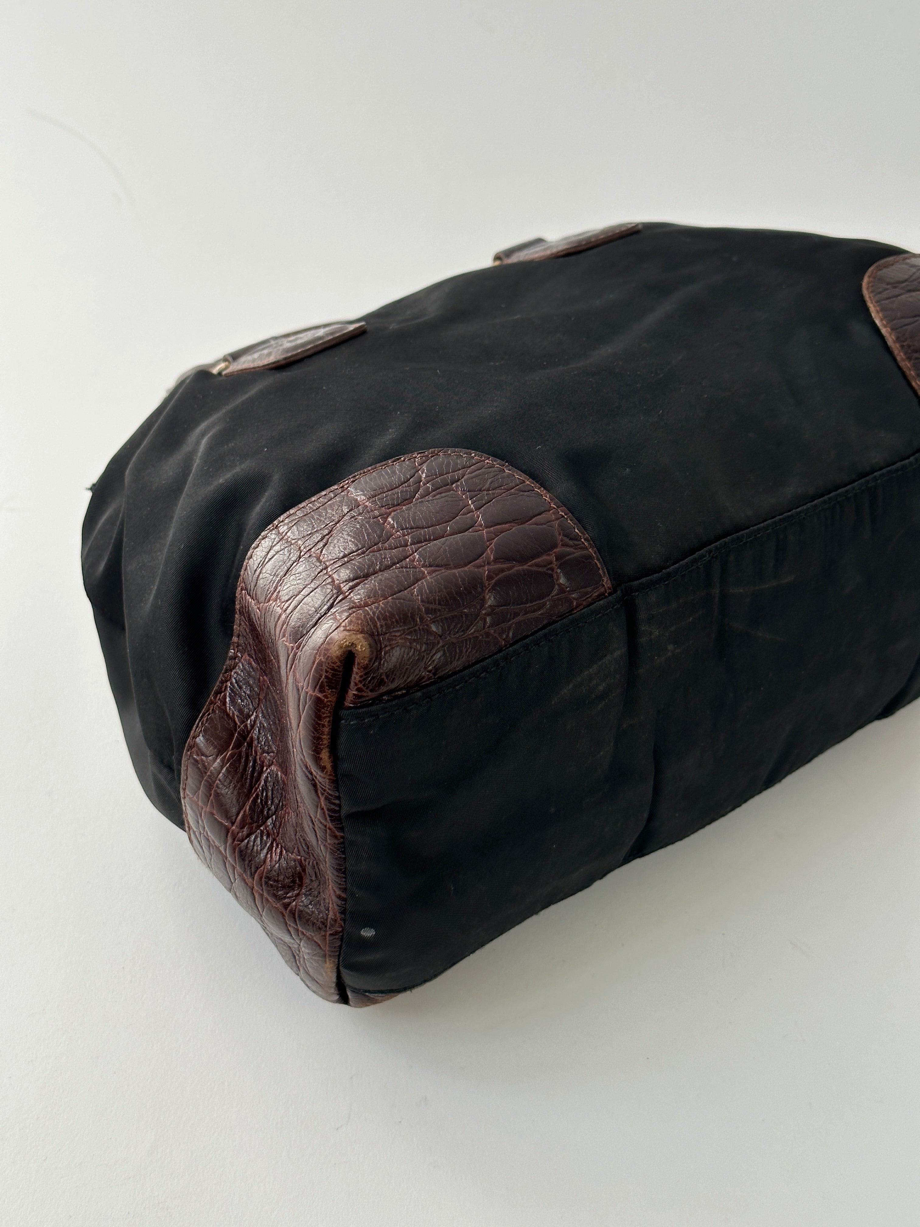 Prada nylon croc handbag with sleek design, featuring textured crocodile pattern and sturdy strap for stylish everyday use.