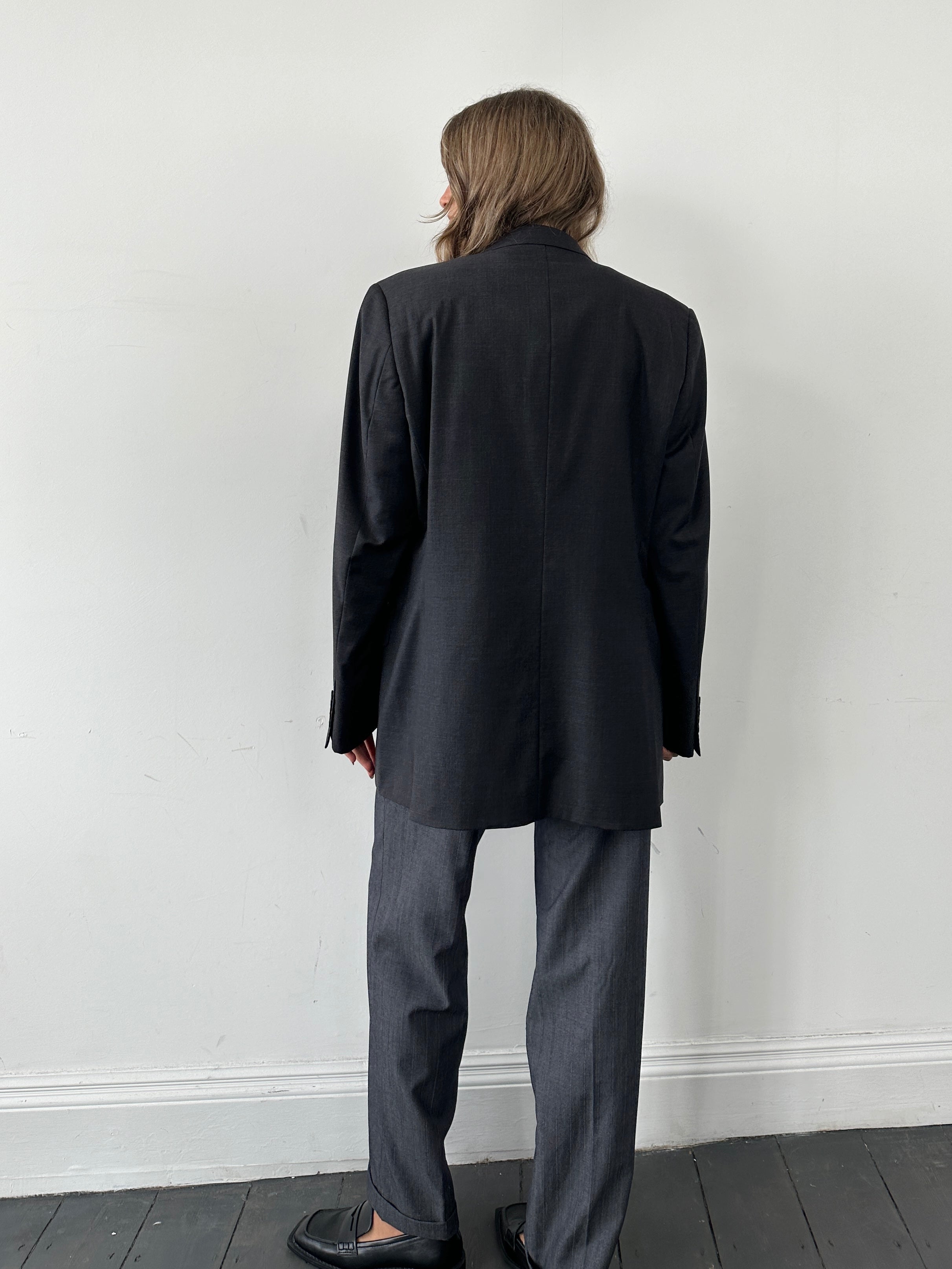 Jaeger single-breasted pure wool blazer in size 42R/L, tailored fit with notch lapel and classic design, shown on a hanger.