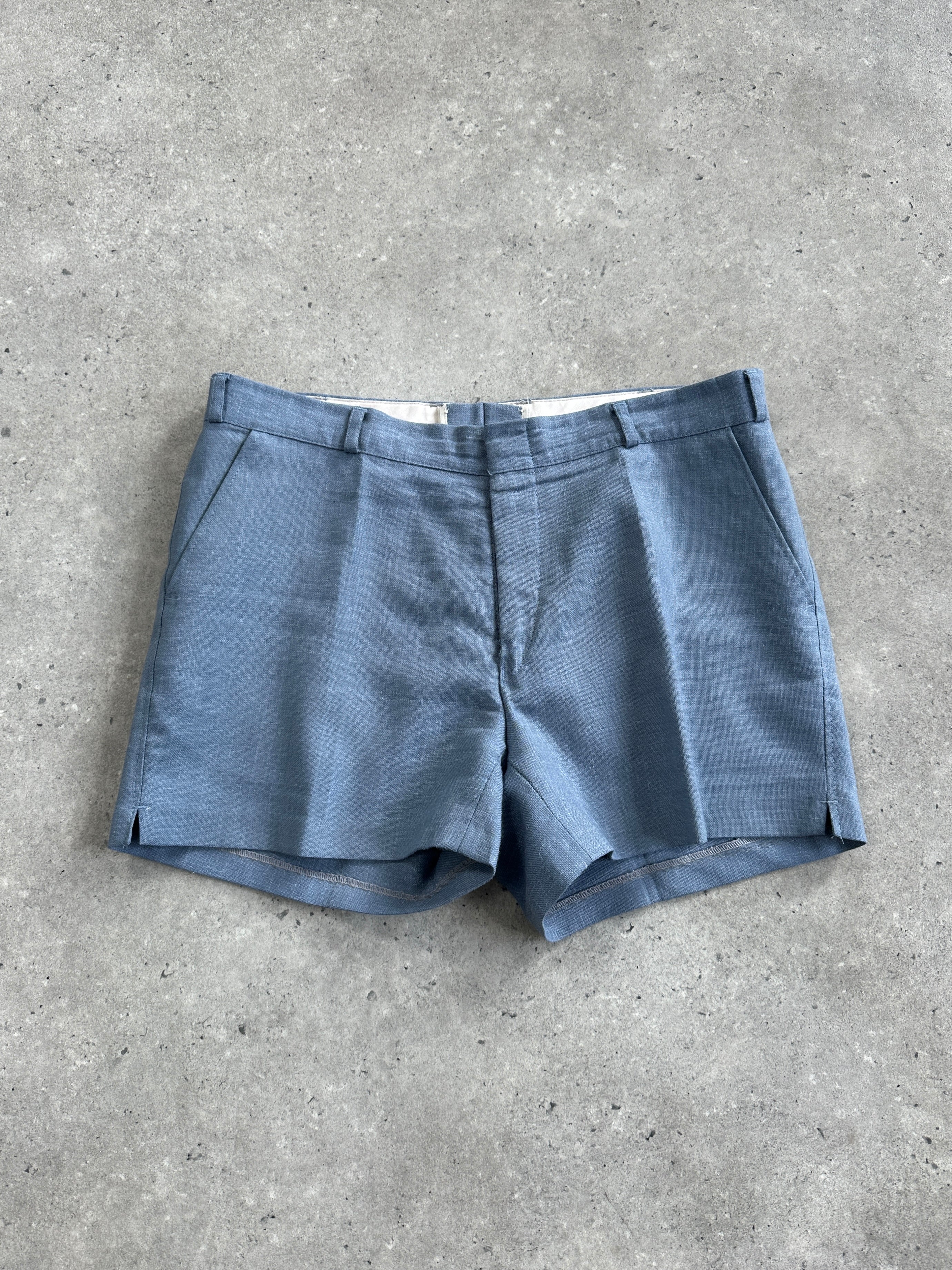 Vintage low-mid waisted tailored mini shorts in W30, featuring a classic fit and stylish design, shown on a neutral background.