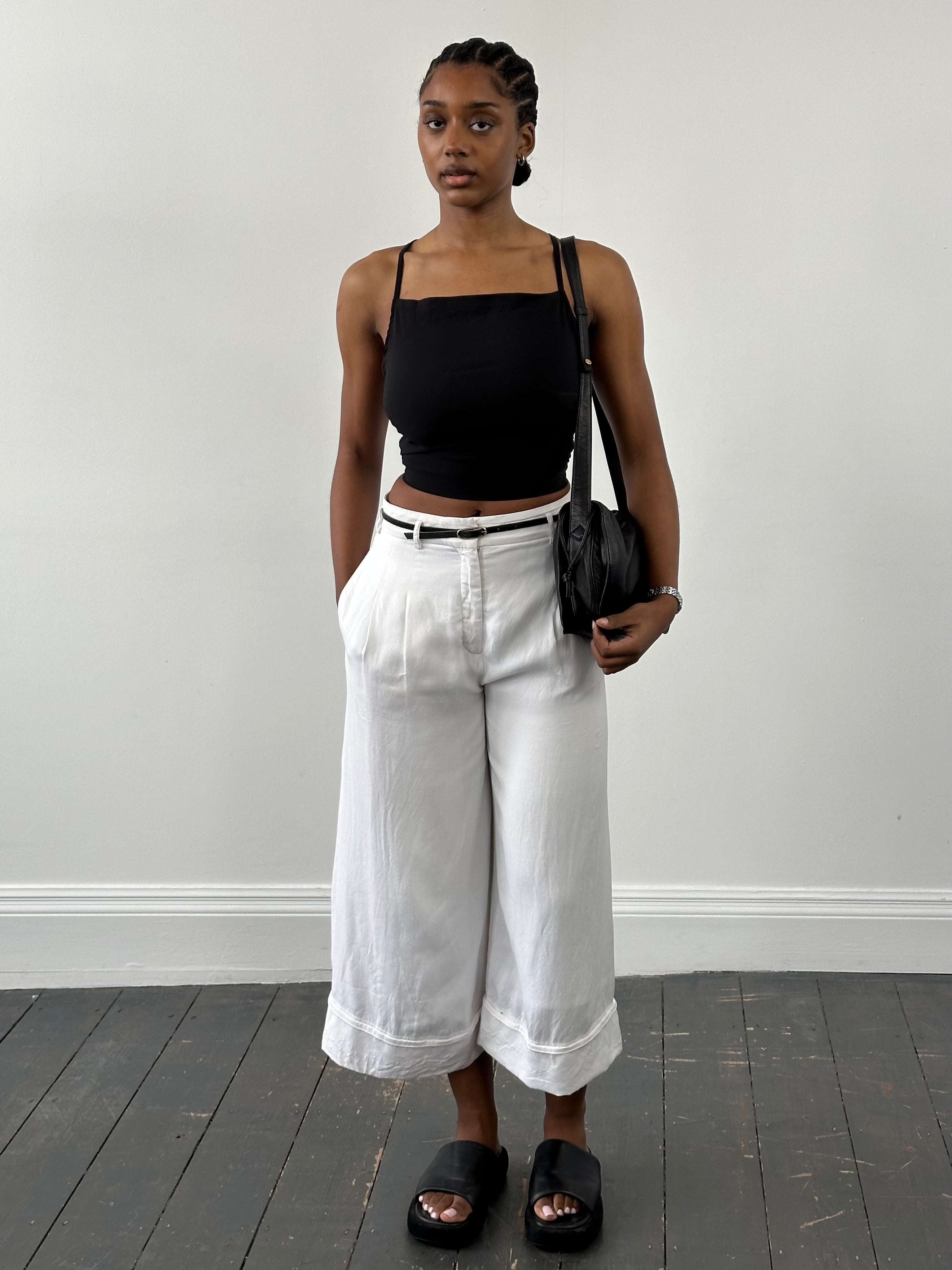 Vintage 2000s viscose back strap cropped top in black, featuring a fitted design and stylish back detail.