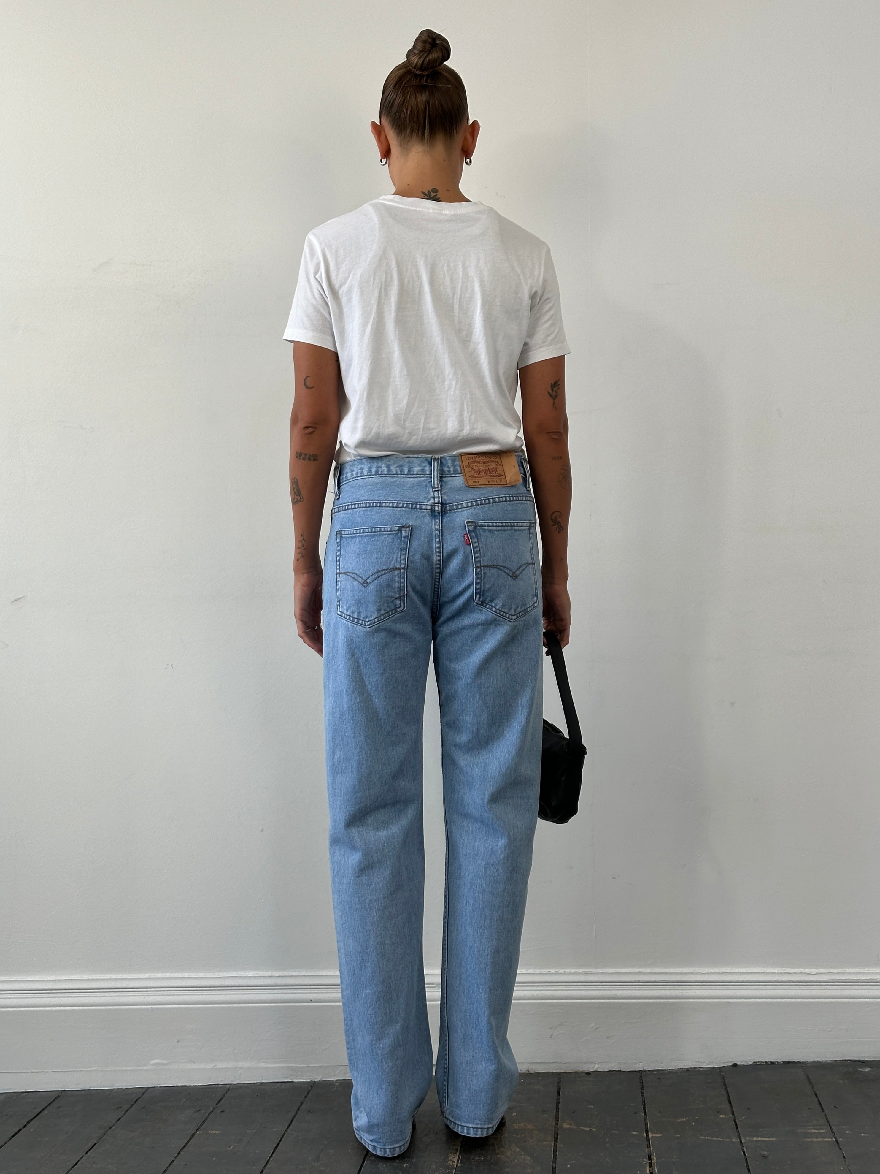 Levi’s 501 light wash straight leg denim jeans for men, featuring classic fit and W30 waist, shown on a plain background.