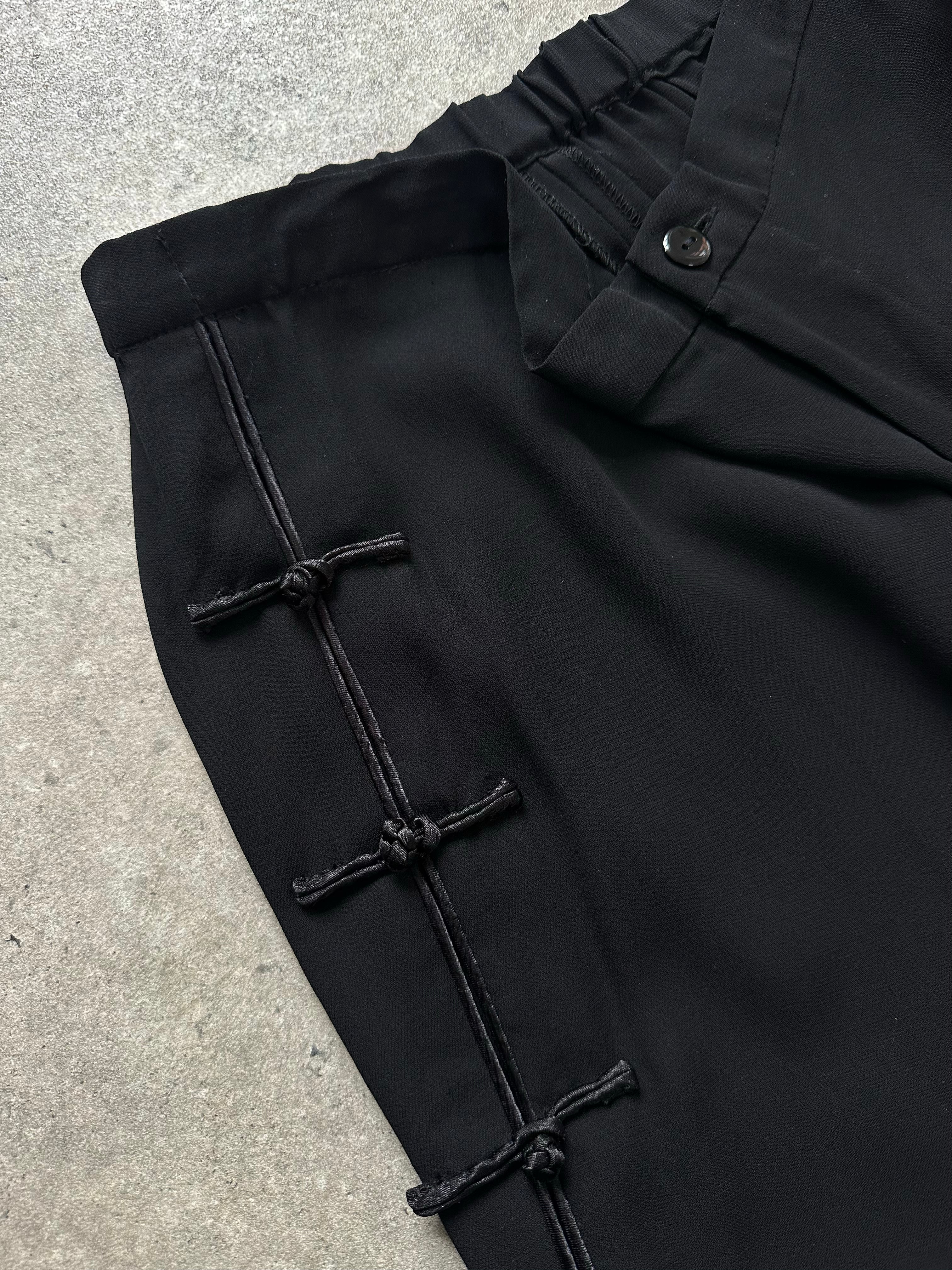 Vintage 1990s pure silk wide leg trousers, size W28, featuring a flowy silhouette and classic style.