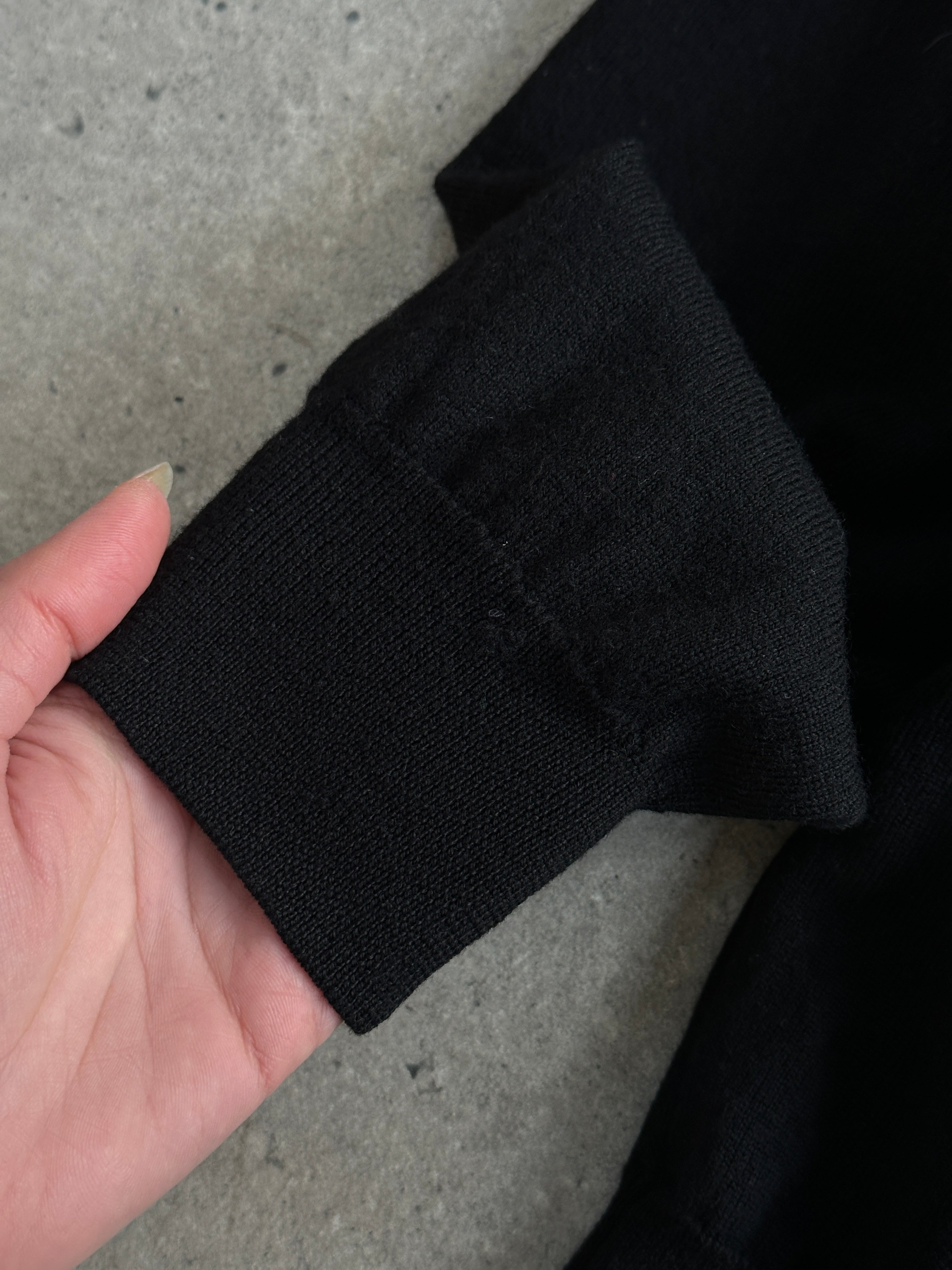 Valentino pure wool logo turtleneck jumper in size M/L, featuring a classic turtle neck and Valentino branding, in a neutral color.