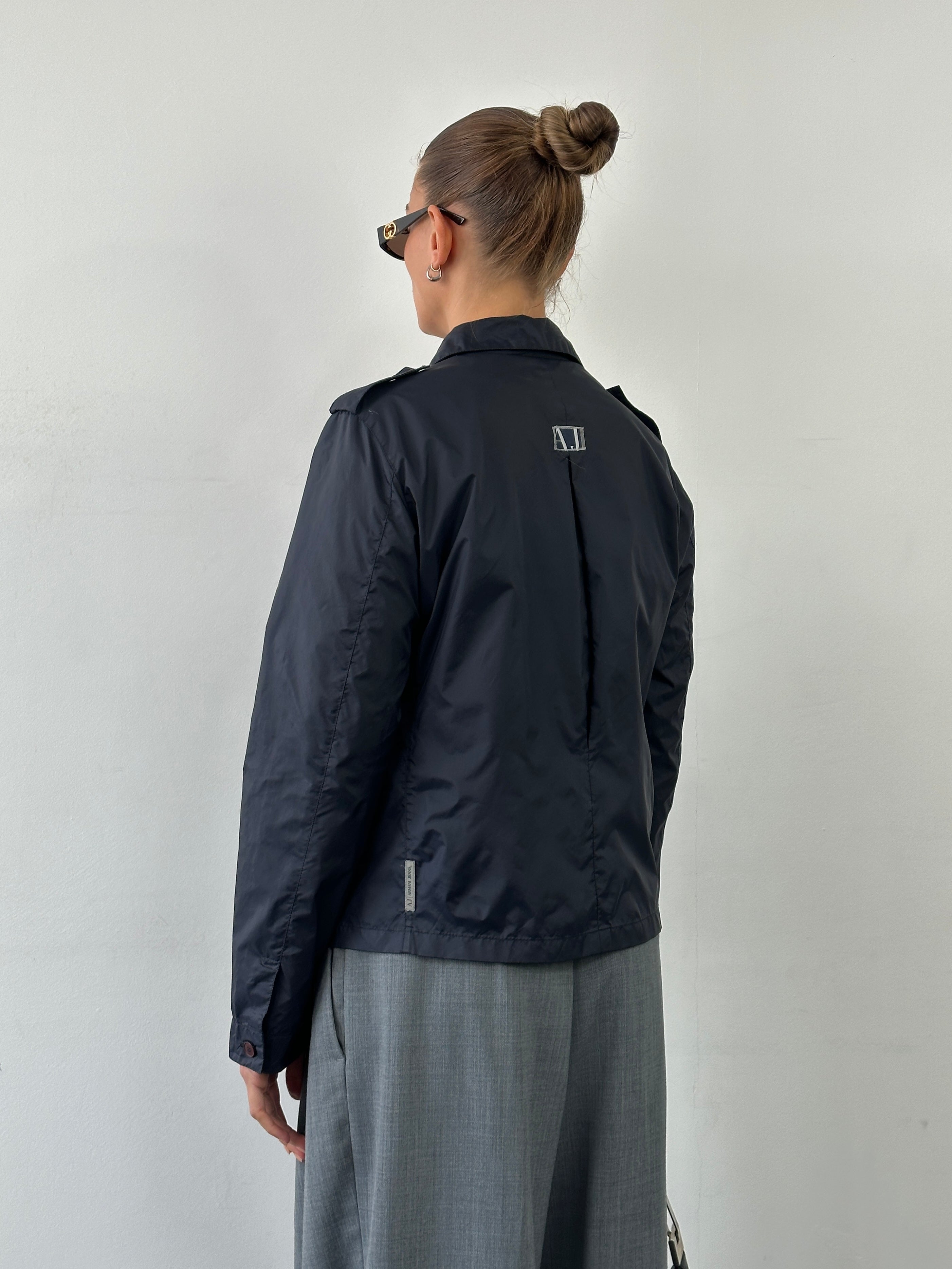 Armani Jeans 1990s showerproof nylon lightweight logo jacket in black, with front zip and subtle logo detailing, size S/M