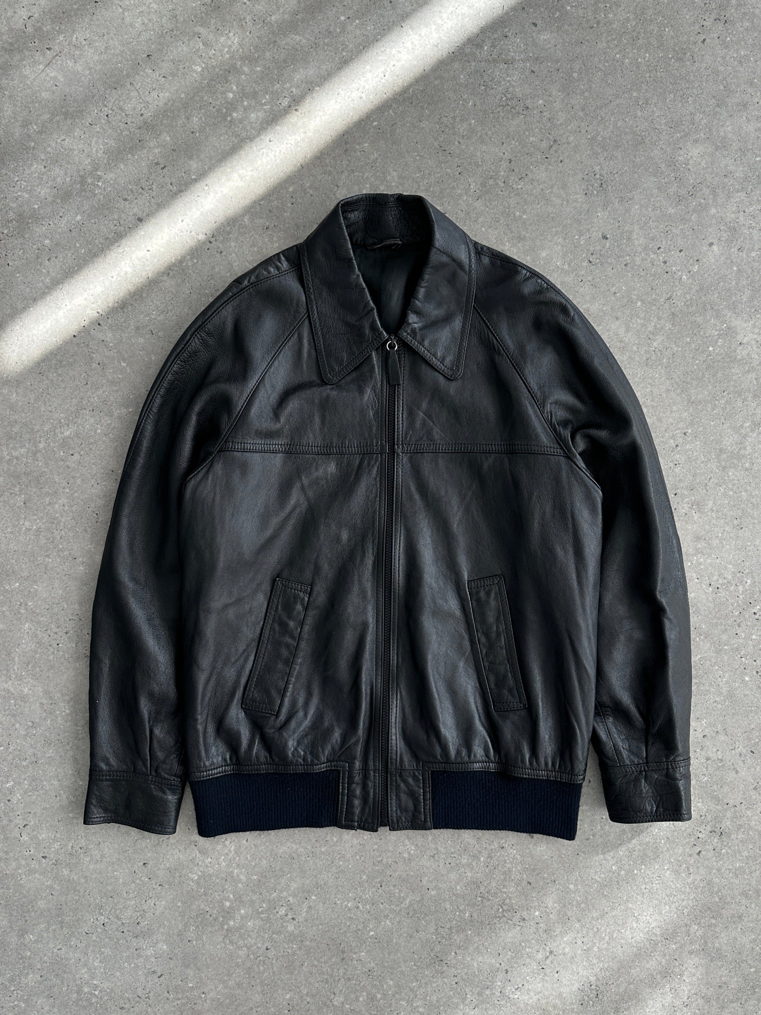 Vintage leather bomber jacket with dagger collar, size large, featuring a stylish vintage design and classic silhouette.
