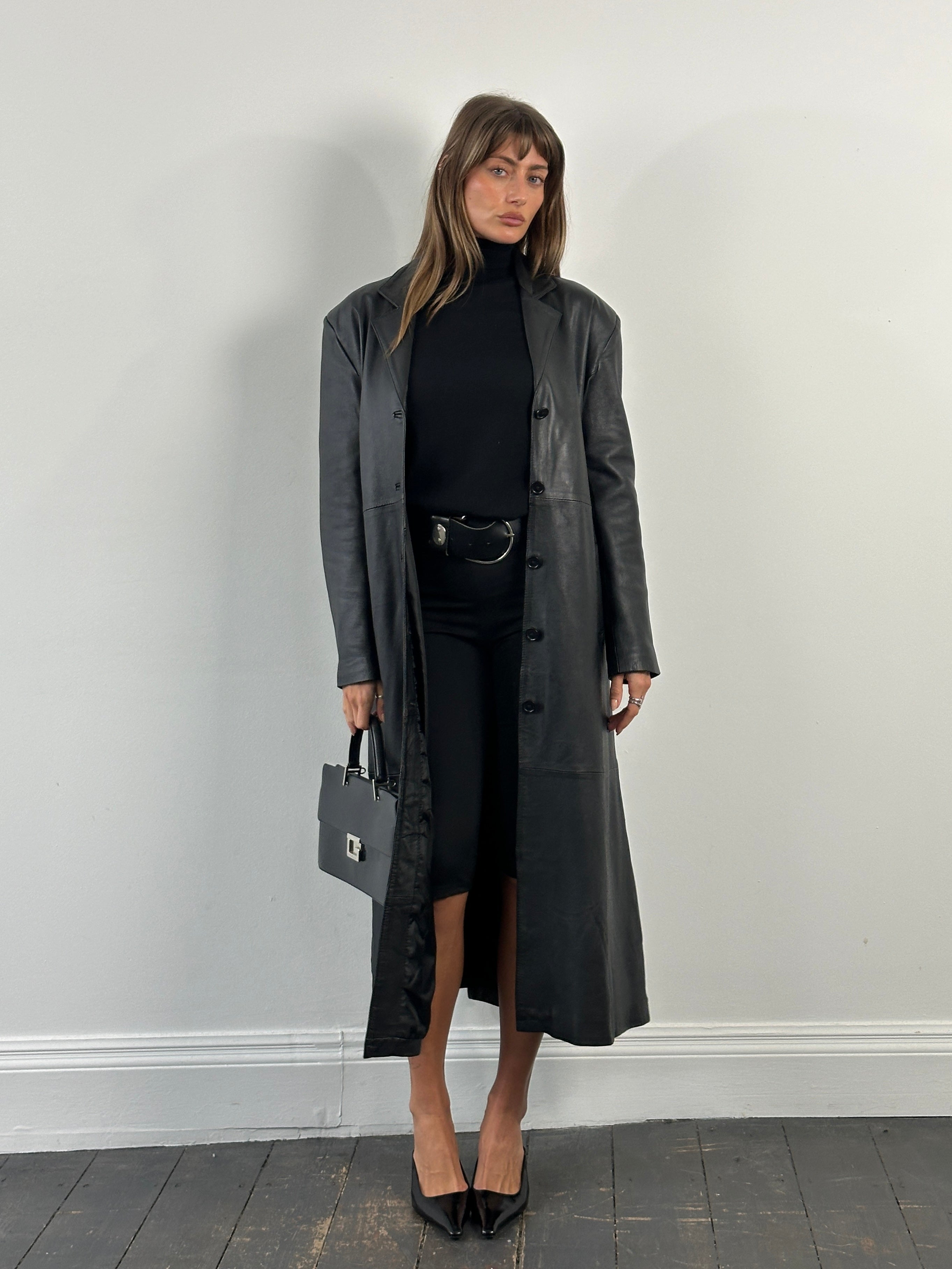 Vintage 1990s floor-length leather trench coat, size large, featuring classic leather jacket design and vintage styling.