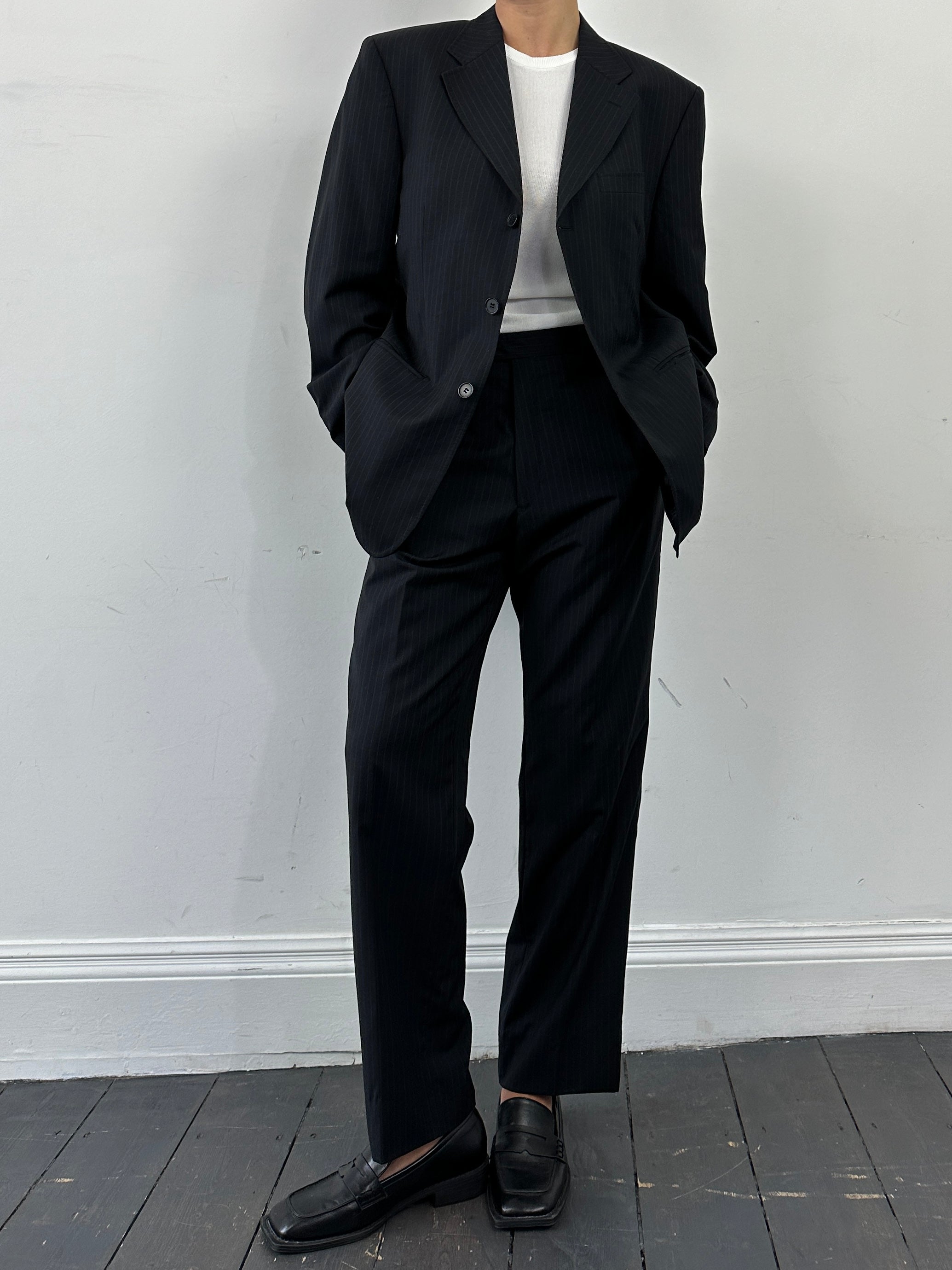 Gianfranco Ferre pinstripe pure wool single-breasted jumpsuit in size 42R/W36, shown on a hanger against a plain background.