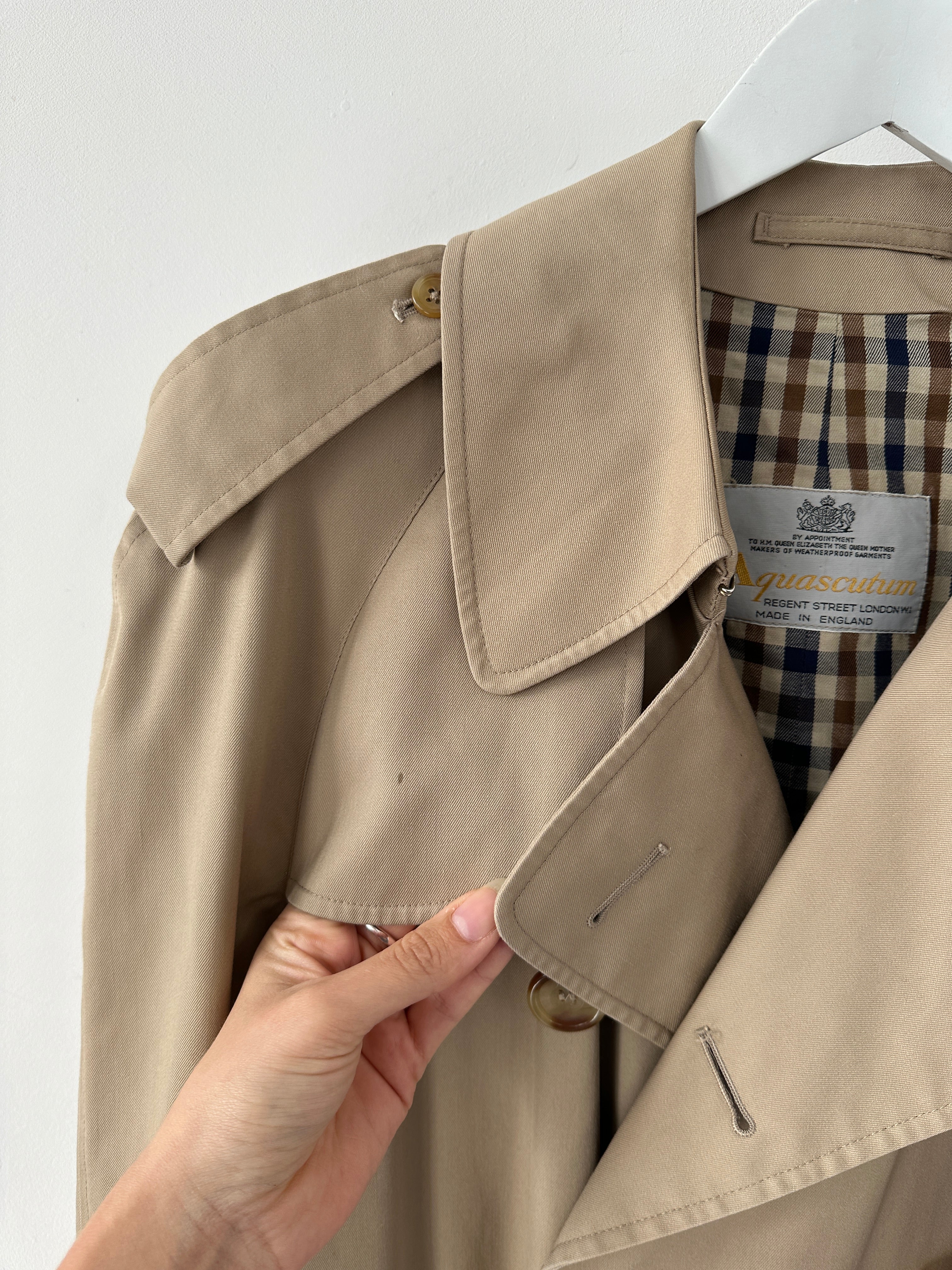 Aquascutum cotton double-breasted belted trench coat in size XL, featuring classic design and tailored fit, shown in the image.