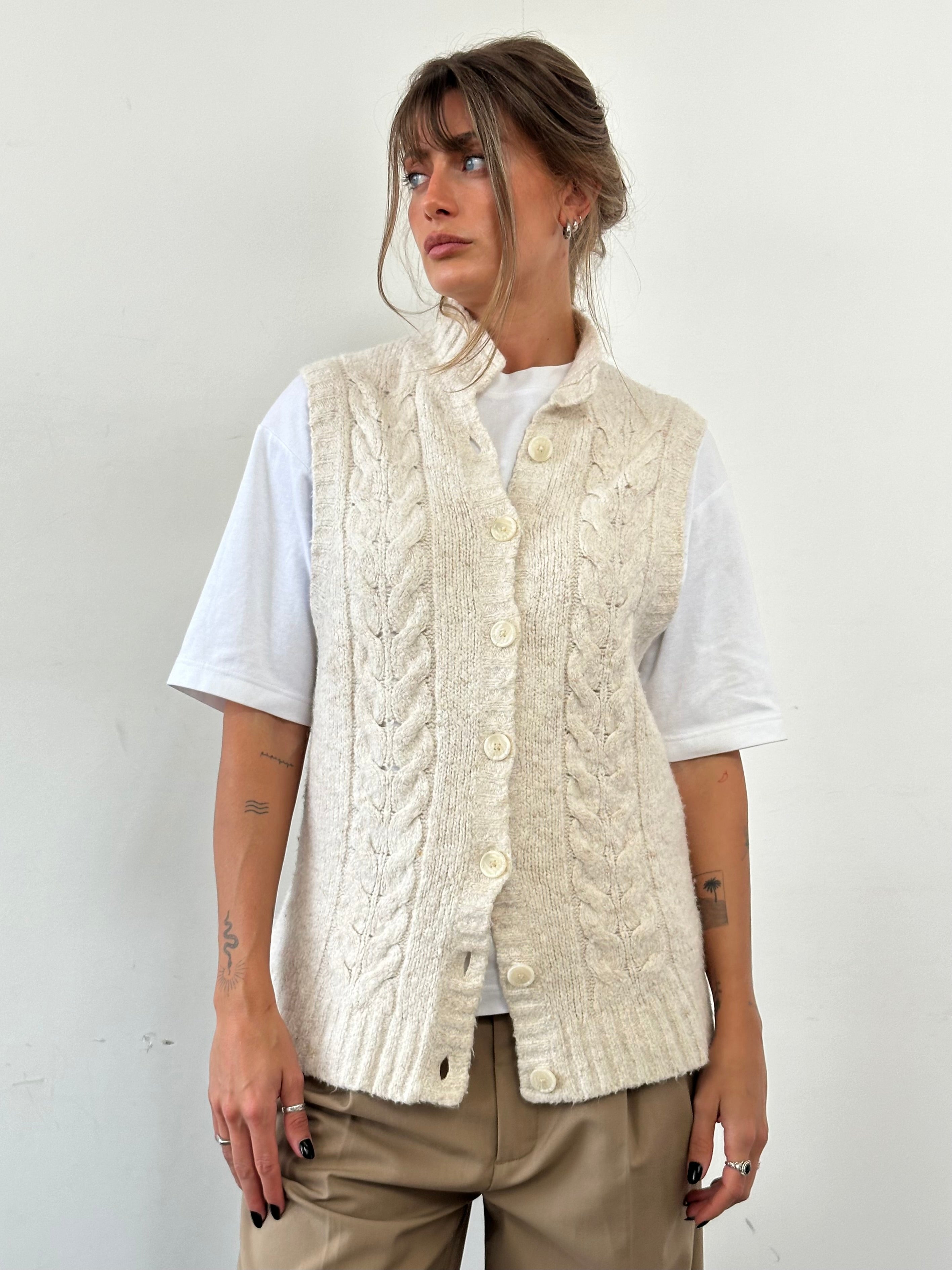 L.L. Bean wool sleeveless knitted cardigan in size large, beige color, featuring a button-up front and cozy textured knit fabric.
