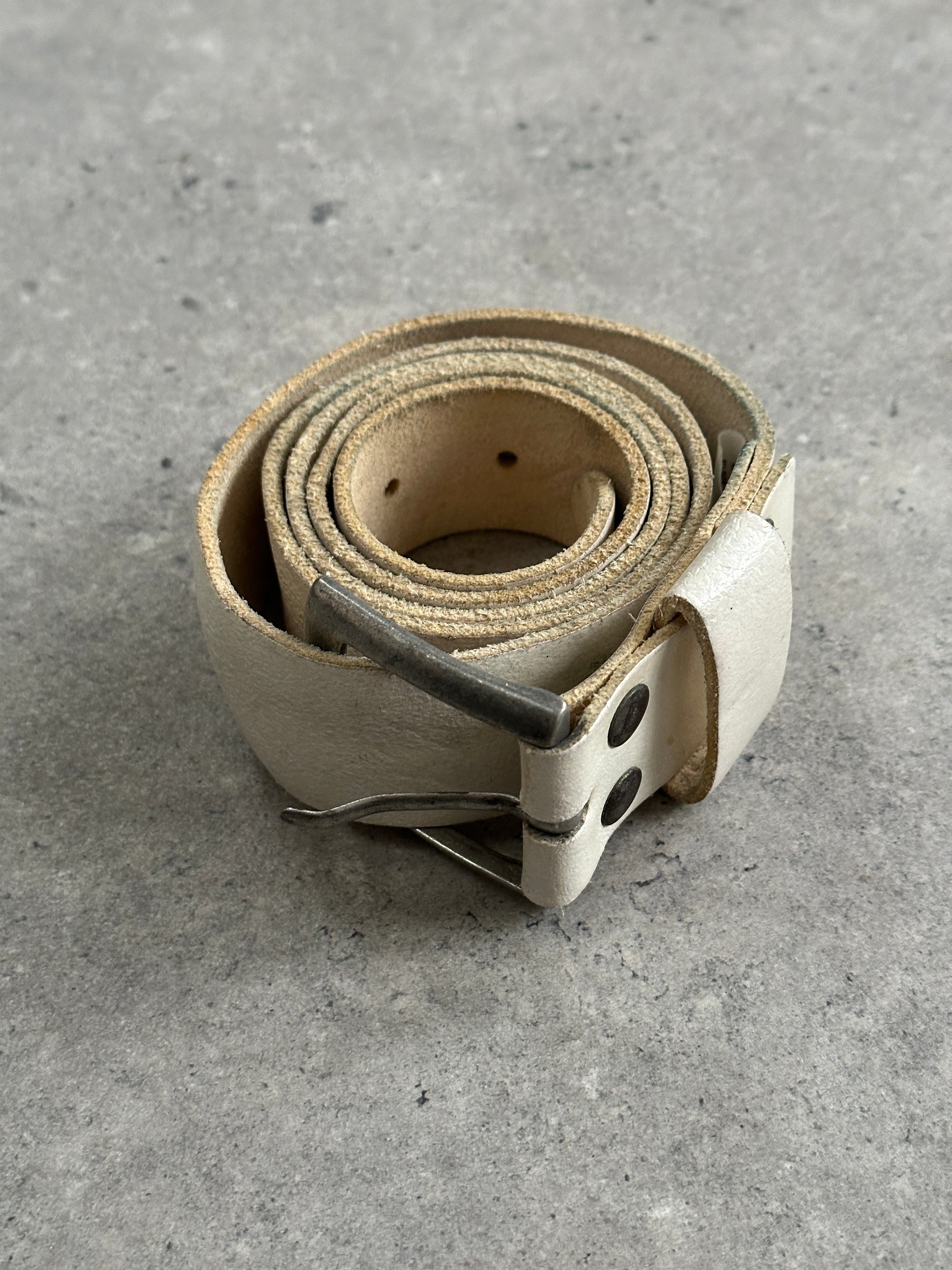 Vintage distressed leather belt in W36-40 with a rugged, worn appearance, showcasing natural leather texture and craftsmanship.