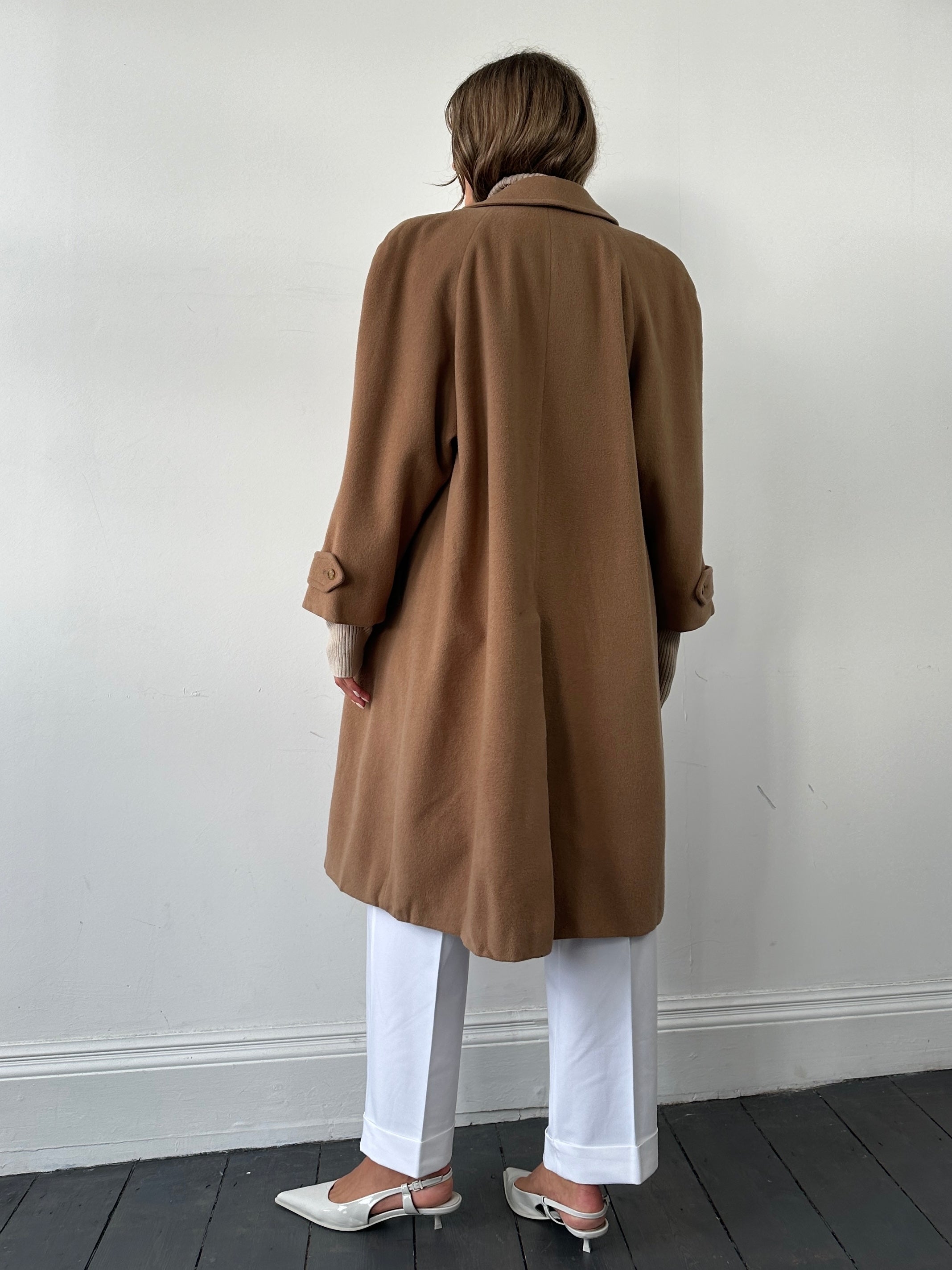 Burberry wool camel hair single-breasted coat in size L, showcased on a hanger with a classic tailored fit.