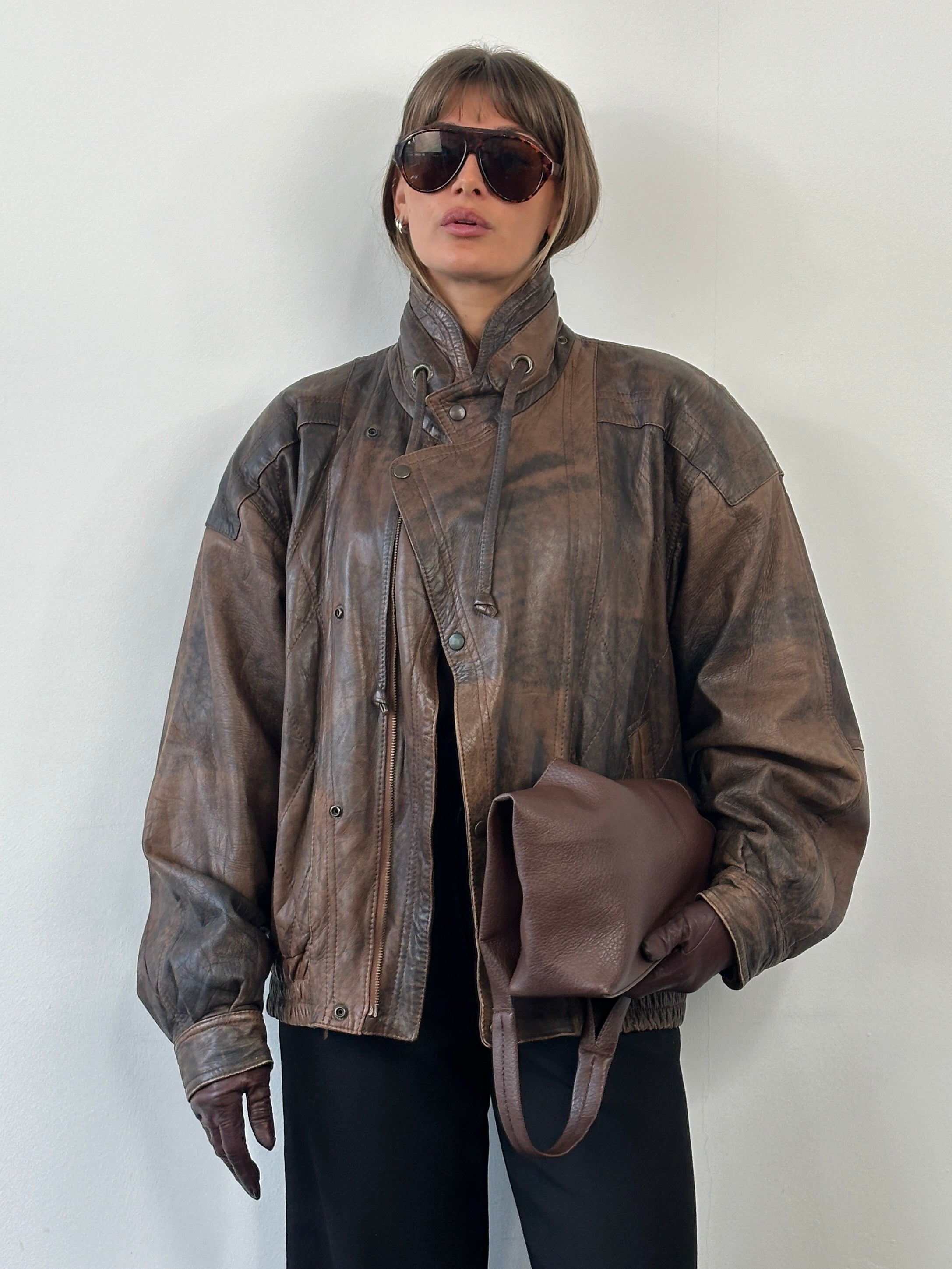 Vintage 1990s high neck leather bomber jacket in aged leather, size XL, showcasing classic vintage style and craftsmanship.