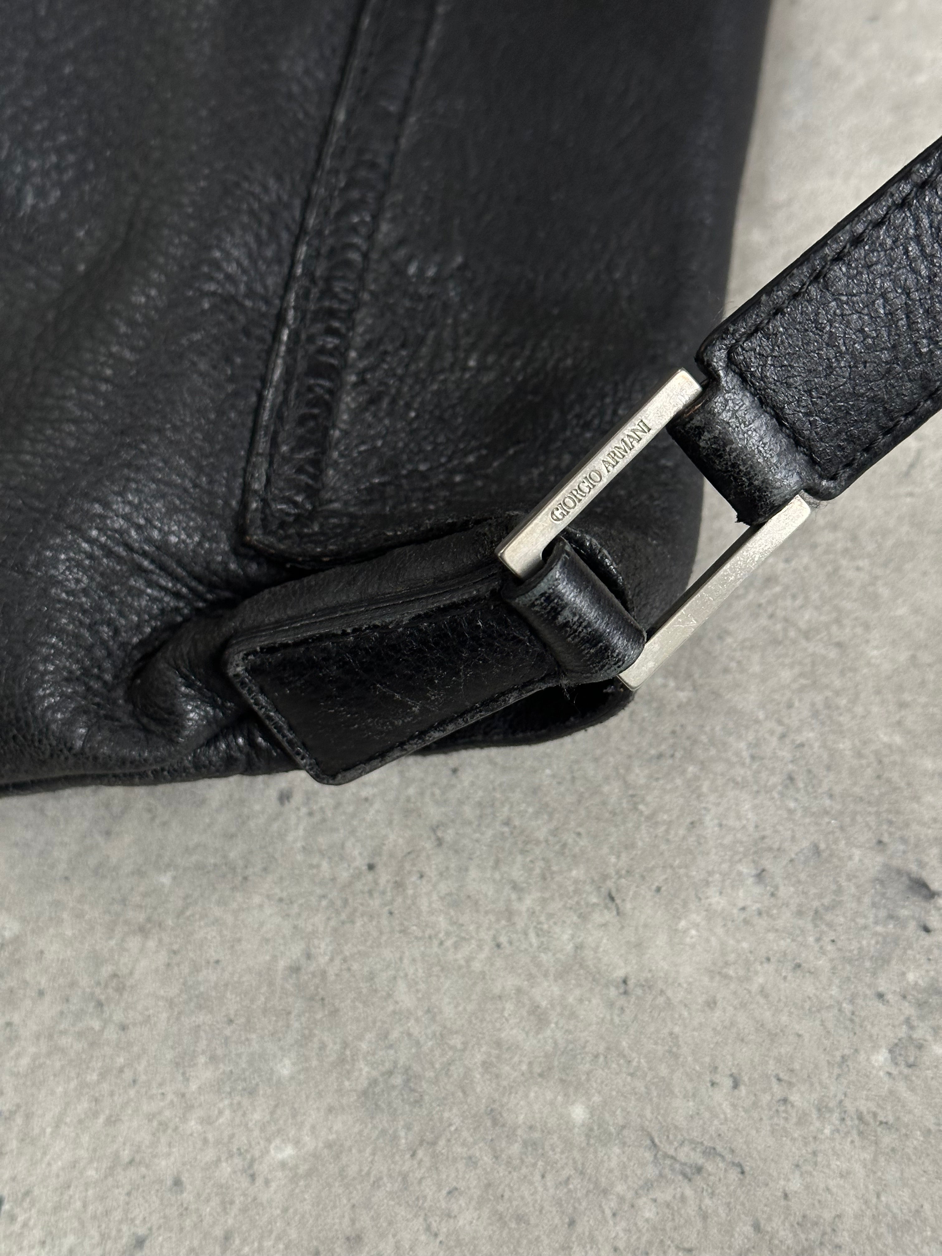 Giorgio Armani 2000s leather crossbody bag with adjustable strap and sleek design, featuring classic Armani branding.