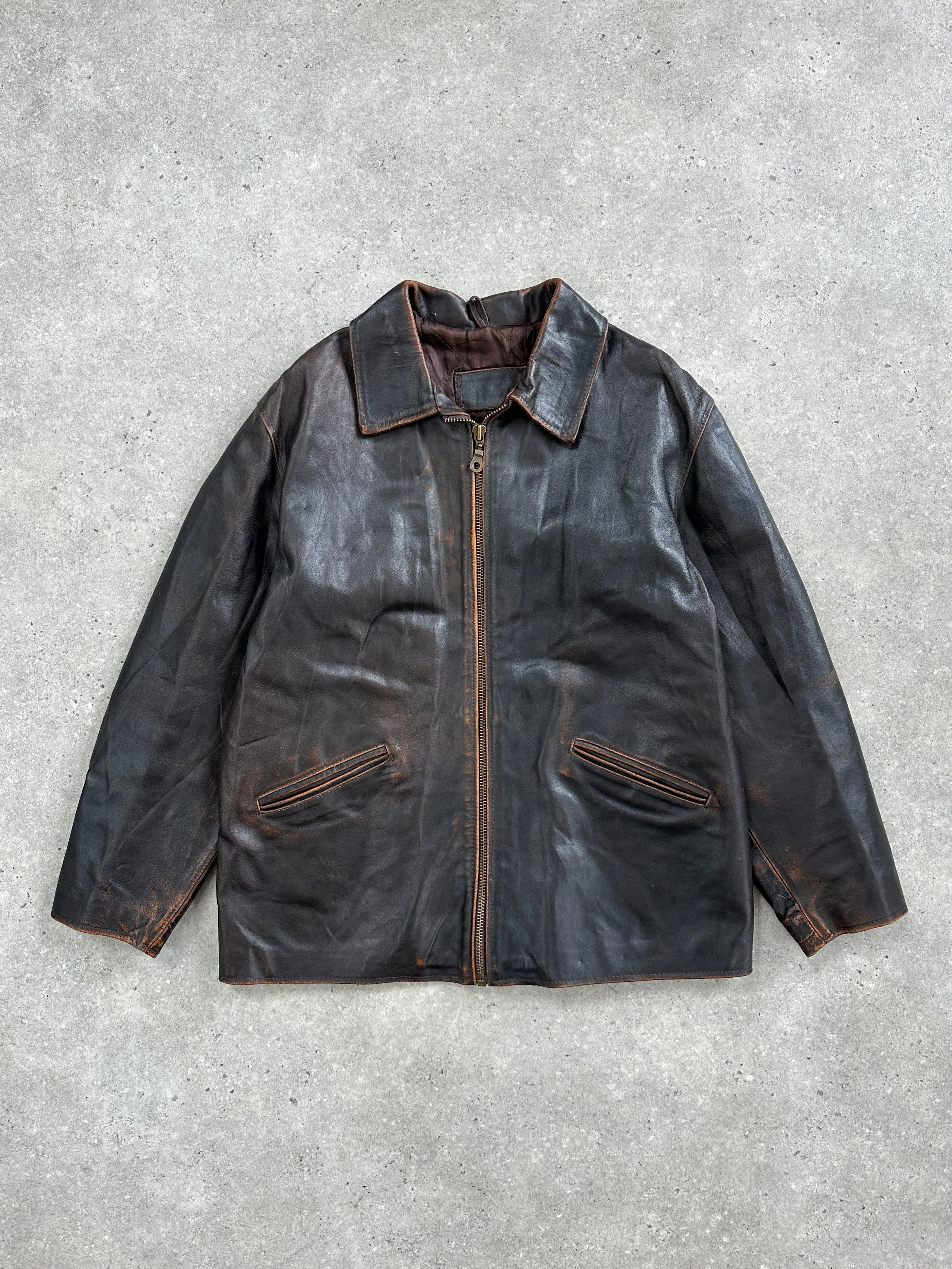 Vintage Italian 1990s distressed leather jacket, L/XL size, showing worn leather texture and classic design details.