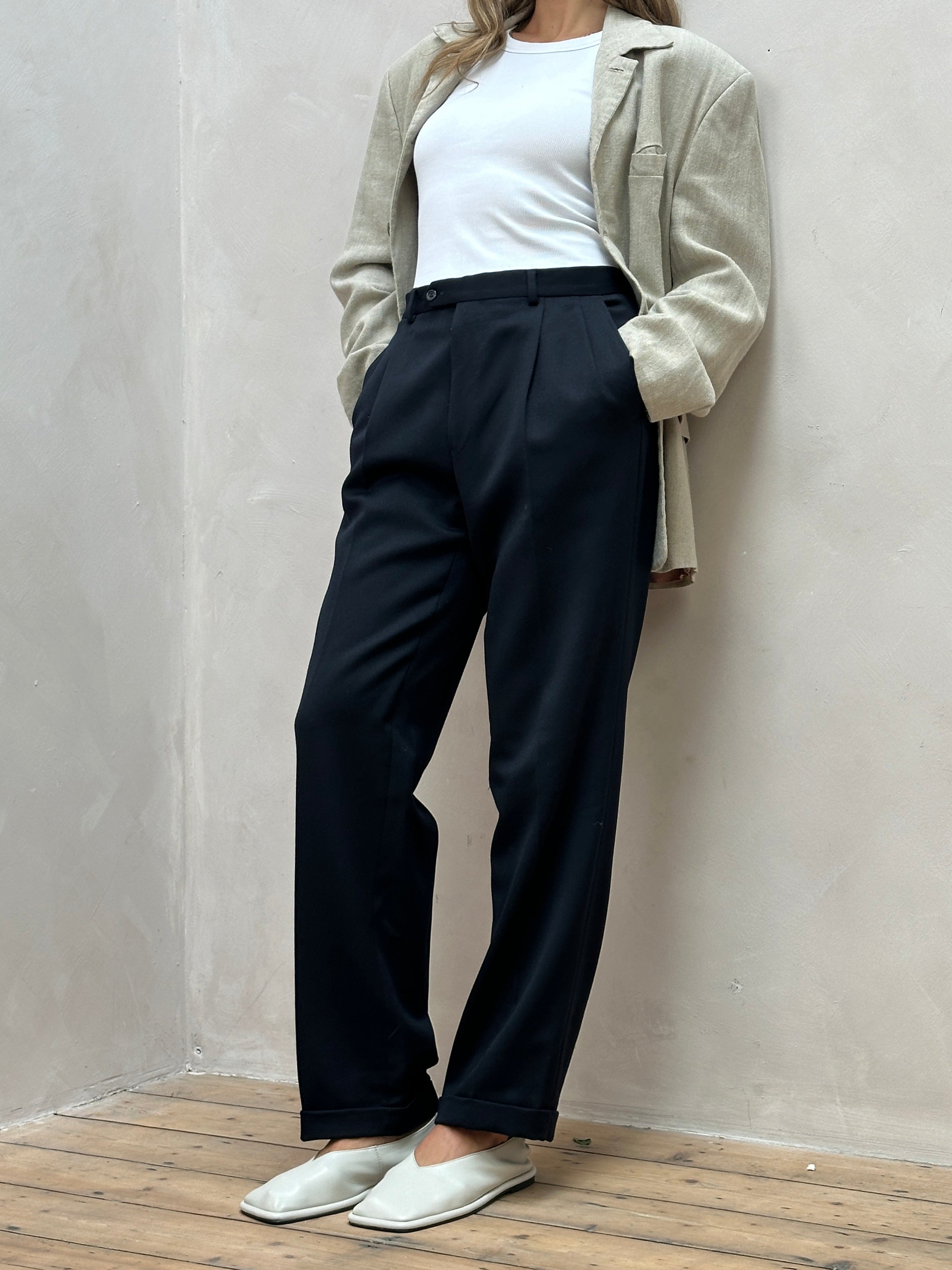 Vintage Italian pure wool high-waisted tailored trousers in a classic design, W34 size, showcasing elegant craftsmanship and fabric.