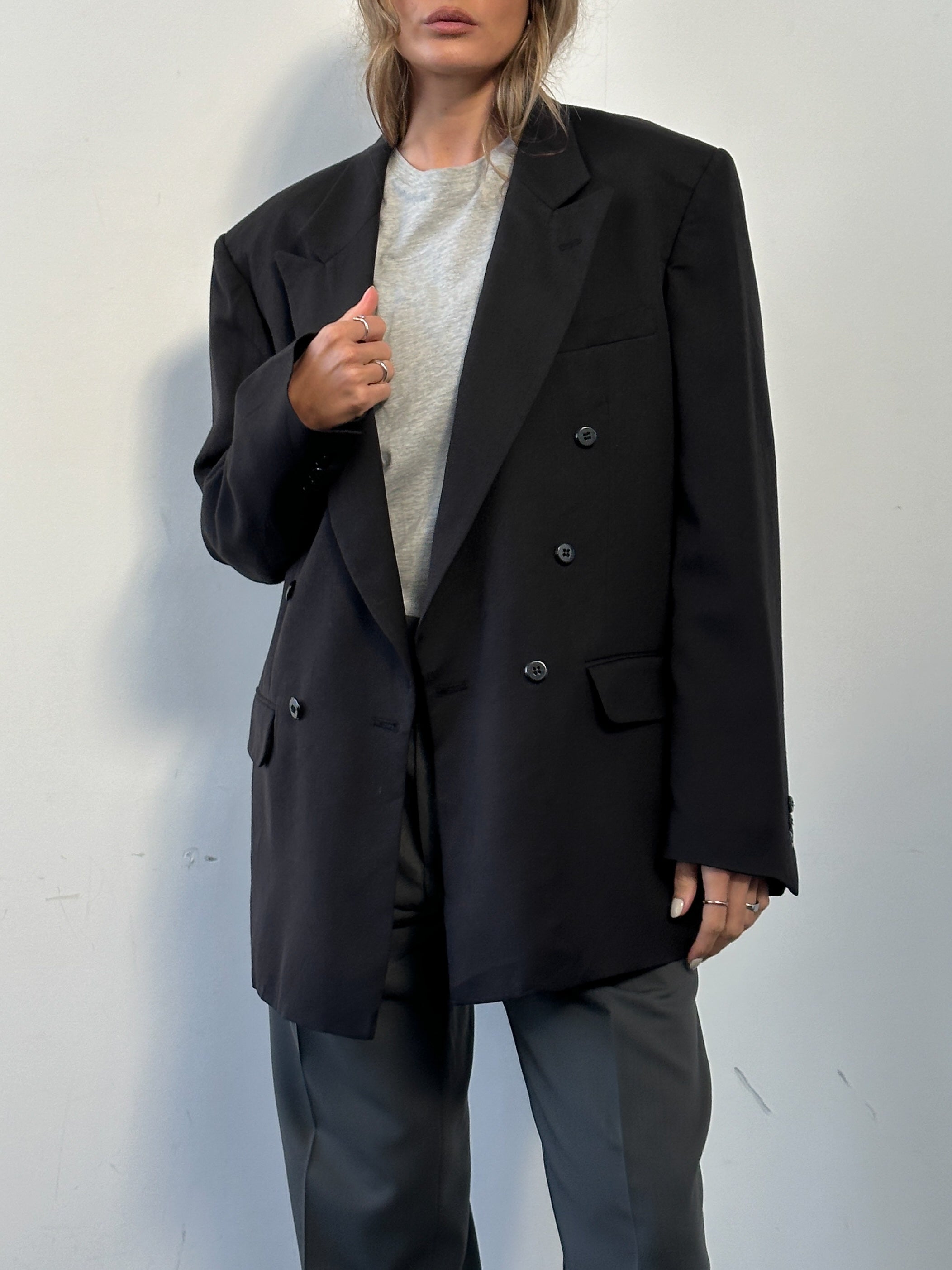 Vintage wool double-breasted blazer in size 40L, featuring classic tailored design and textured fabric.