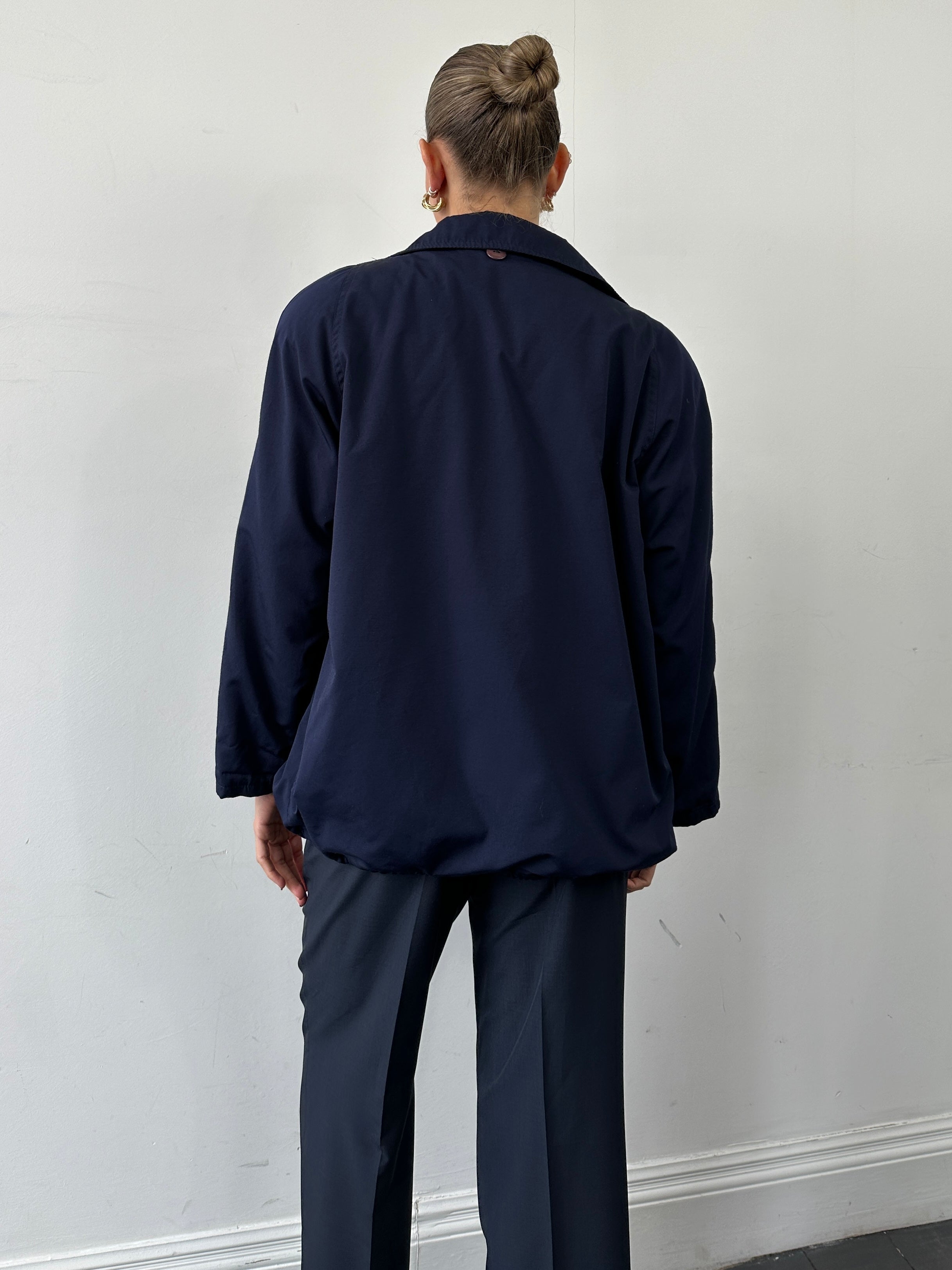 Vintage Italian bomber jacket in M/L size, featuring classic design, ribbed cuffs, and authentic vintage style.