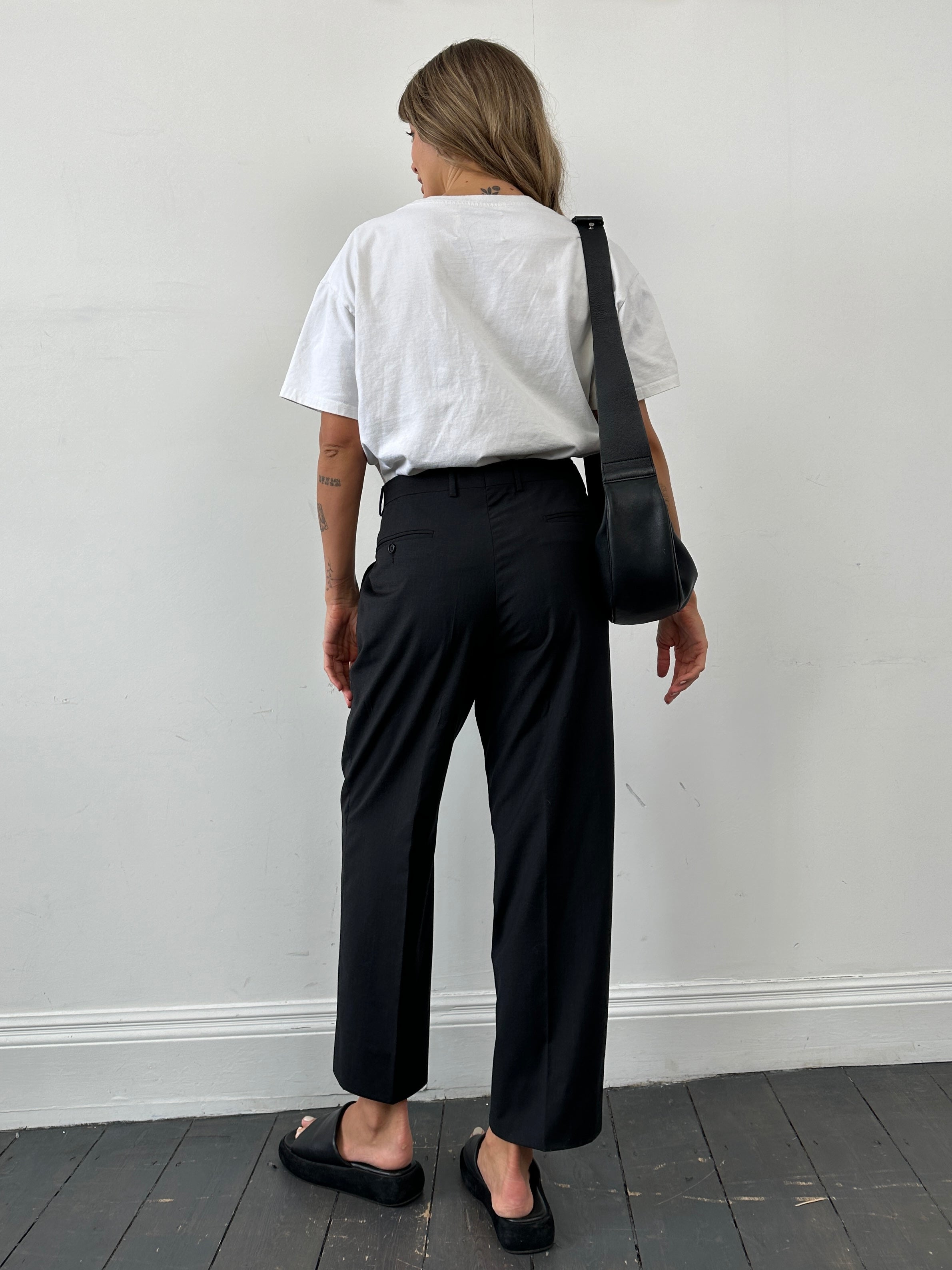 Vintage wool straight-leg tailored trousers in W34, showing classic fit and textured fabric detail.