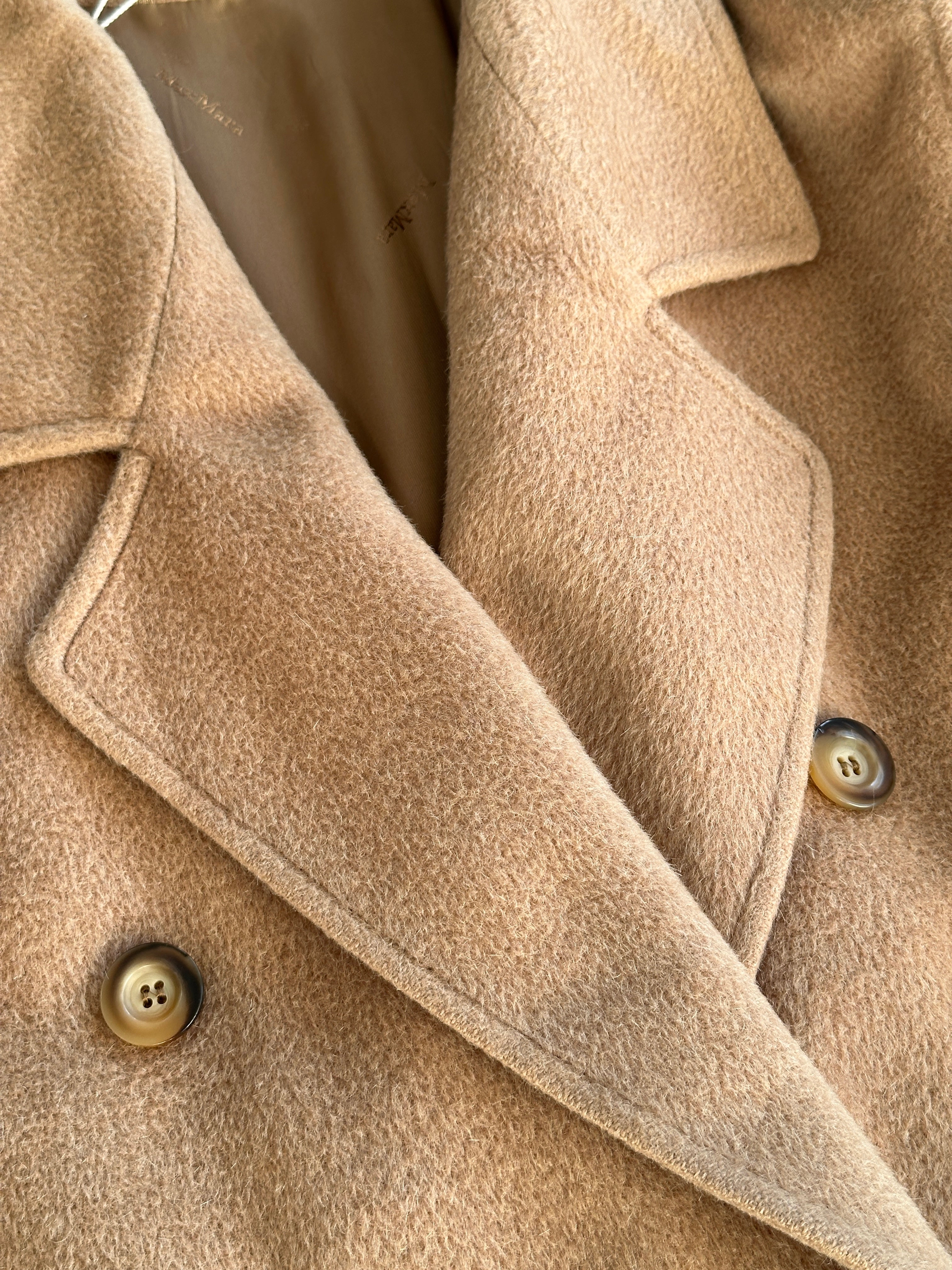 Max Mara wool camel hair double-breasted coat in size M/L, shown on a hanger with front view and tailored details.
