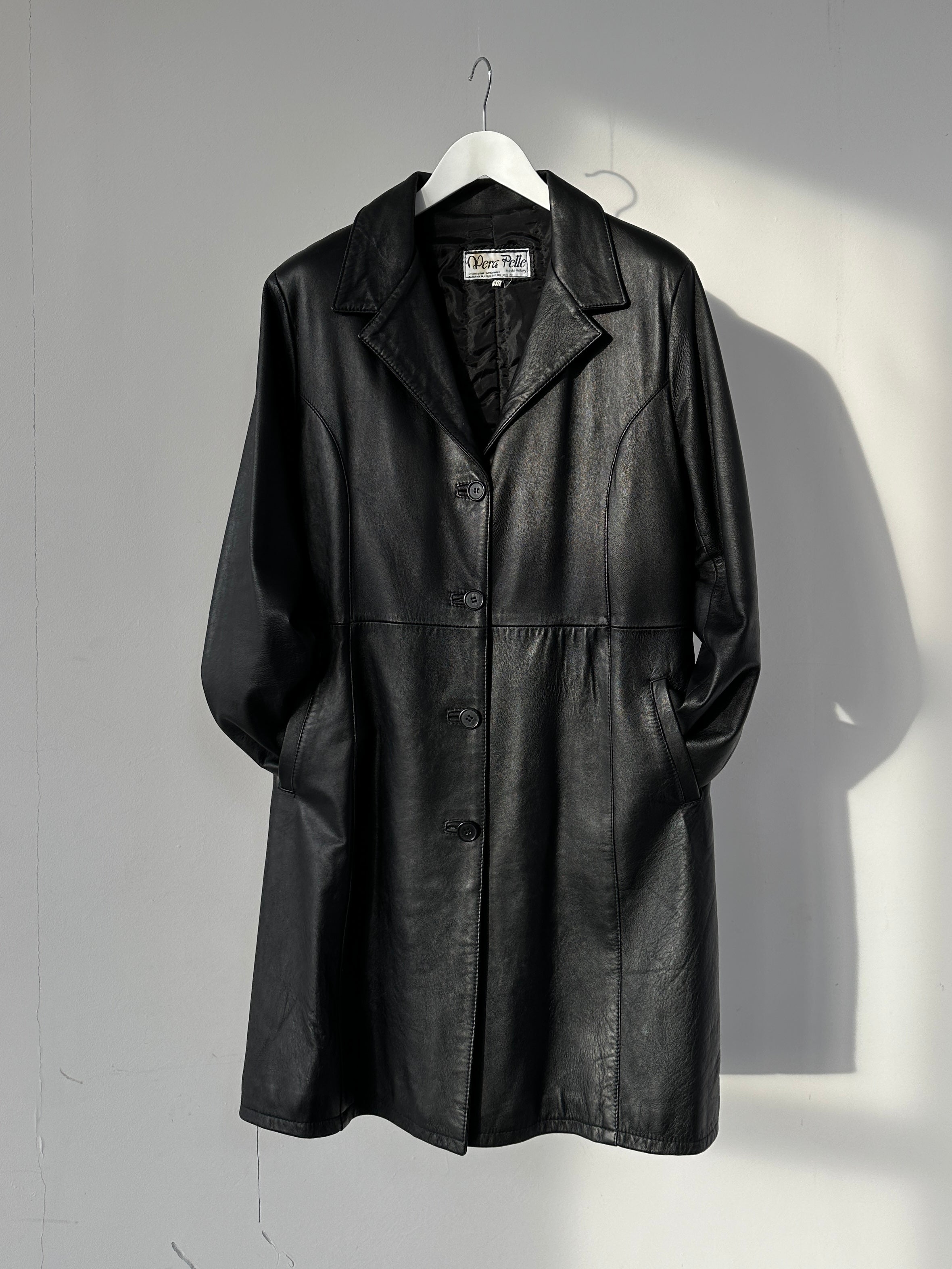 Vintage Italian vintage leather coat jacket in size small, showcasing classic leather texture and stylish design.