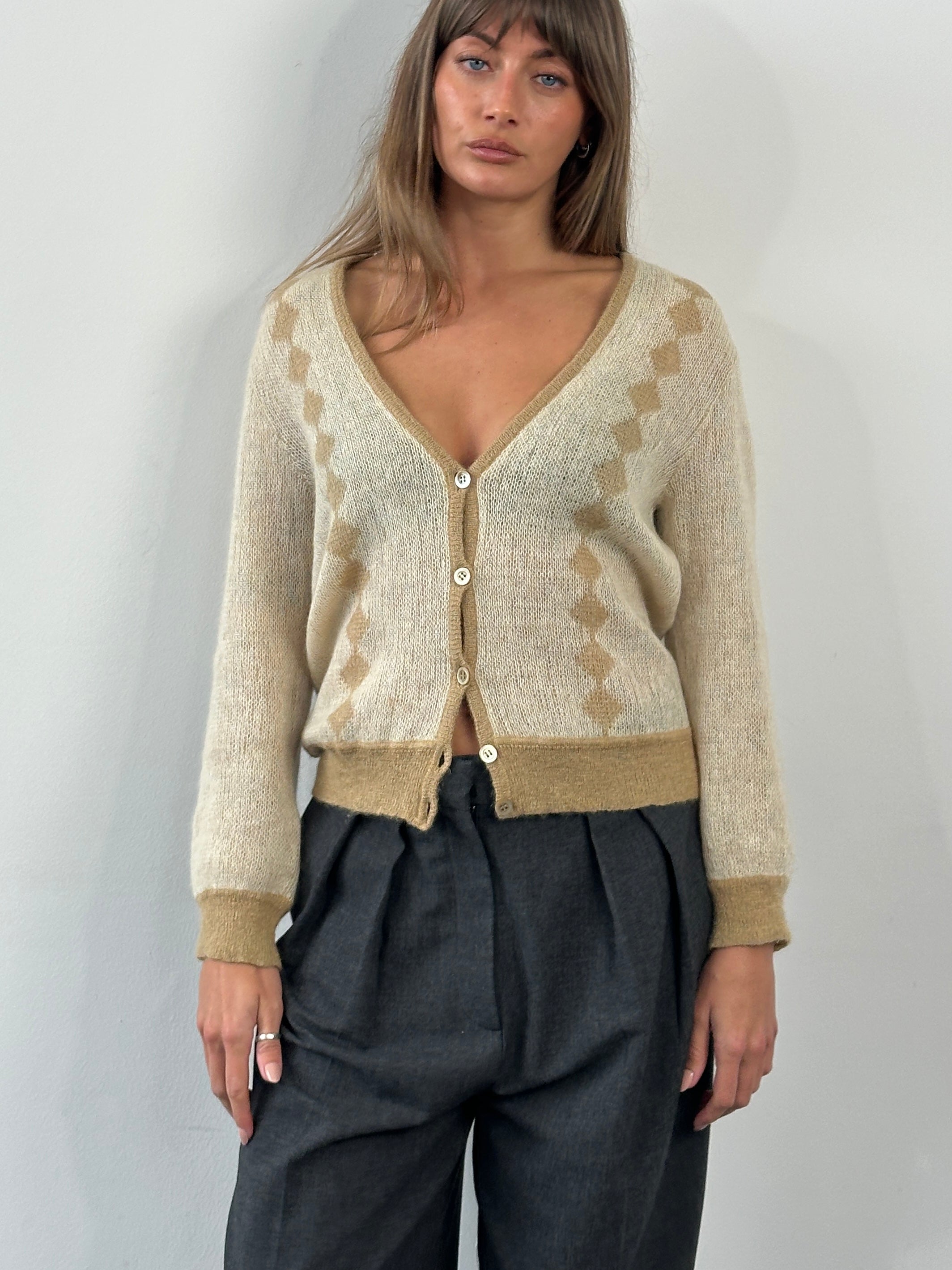 Vintage Italian 1980s mohair cardigan in S/M, featuring soft textured fabric and classic design, displayed on a neutral background.