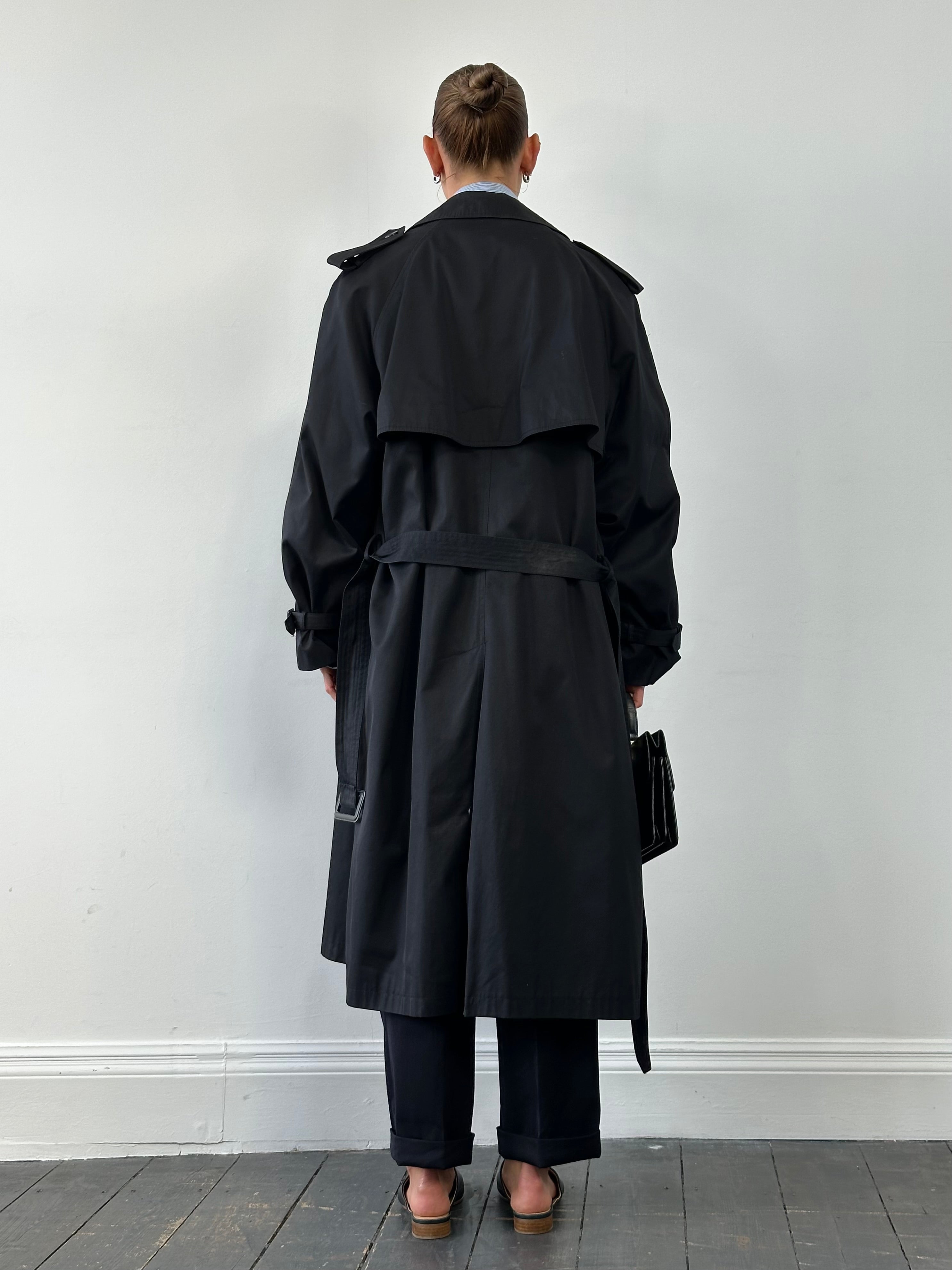 Vintage double-breasted belted trench coat in XL, classic beige color, showing collar, buttons, and waist belt on a hanger.