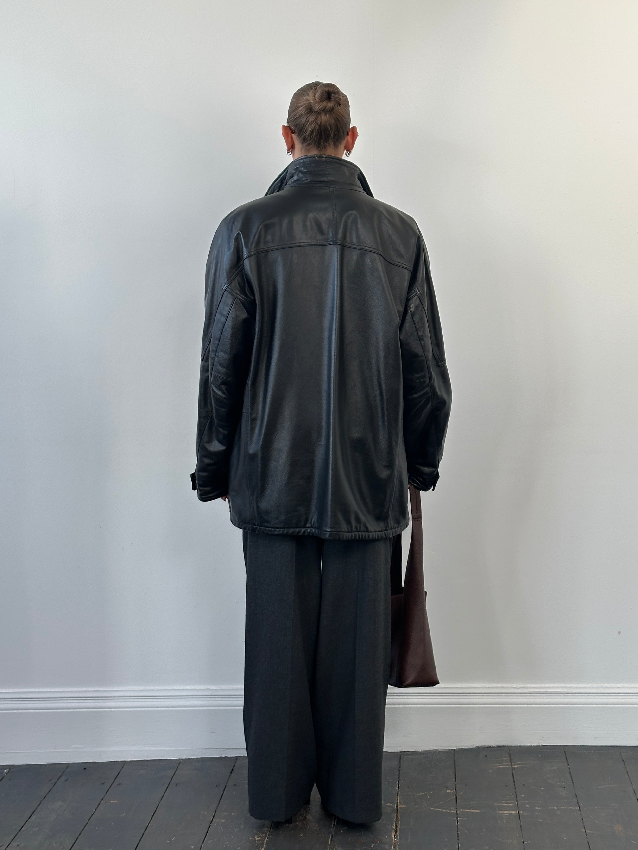 Armani Jeans black leather jacket with high neck and double zipper, XXL size, featuring a sleek, fitted design and stylish details.