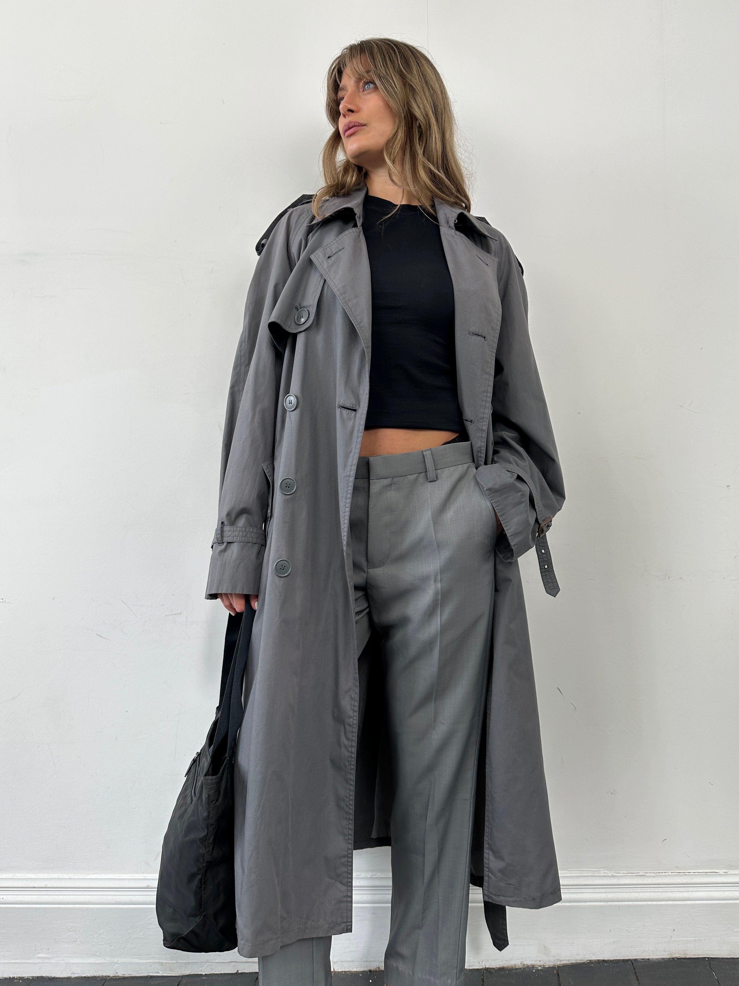 Yves Saint Laurent men's double-breasted belted trench coat in XL/XXL, shown in dark fabric with lapels and waist belt.