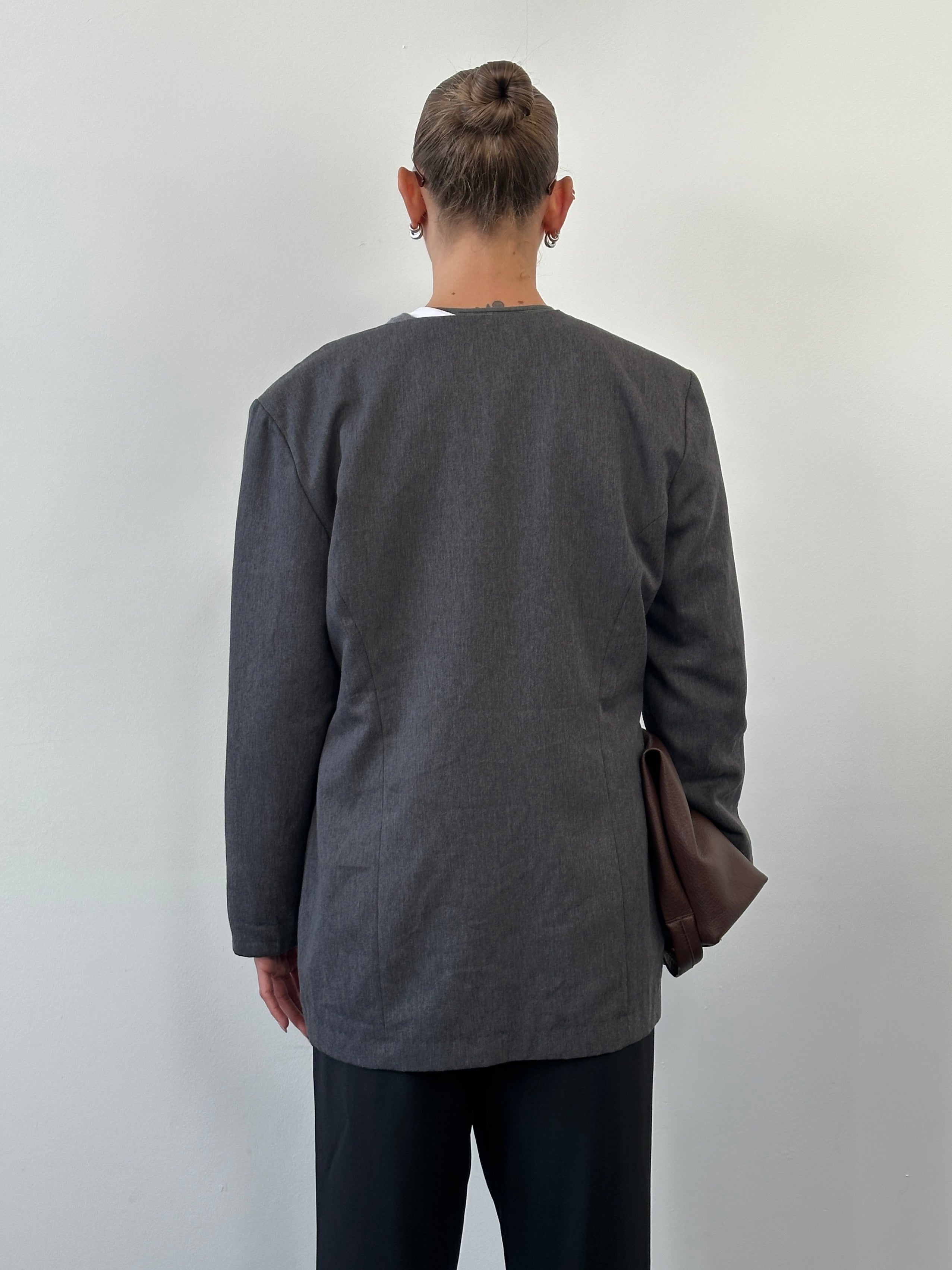 Vintage 1990s minimal collarless blazer in size M/L, featuring sleek tailored design and classic vintage style.