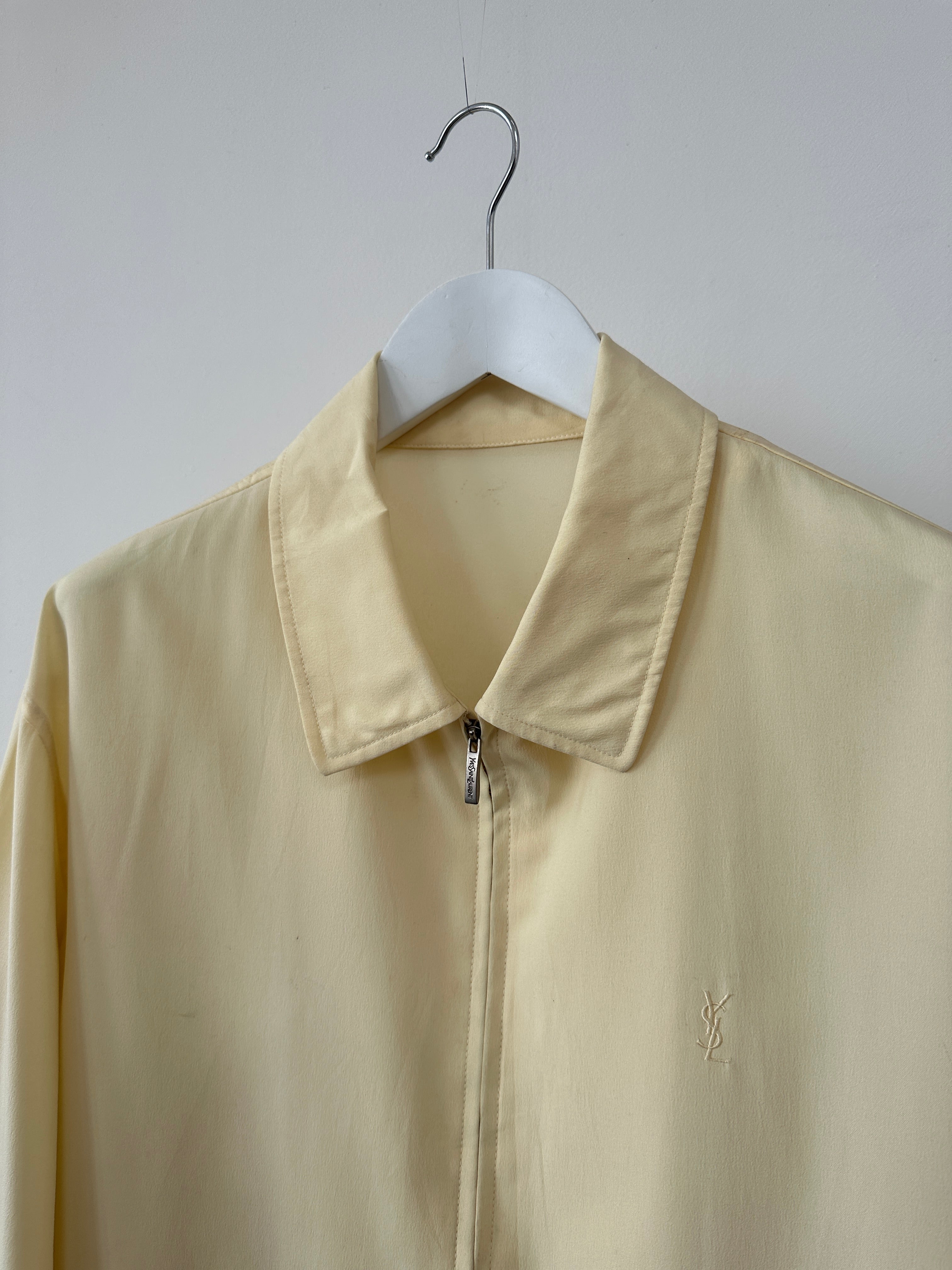 Yves Saint Laurent Pour Homme logo bomber jacket in black, front view showing the signature YSL logo on the chest.